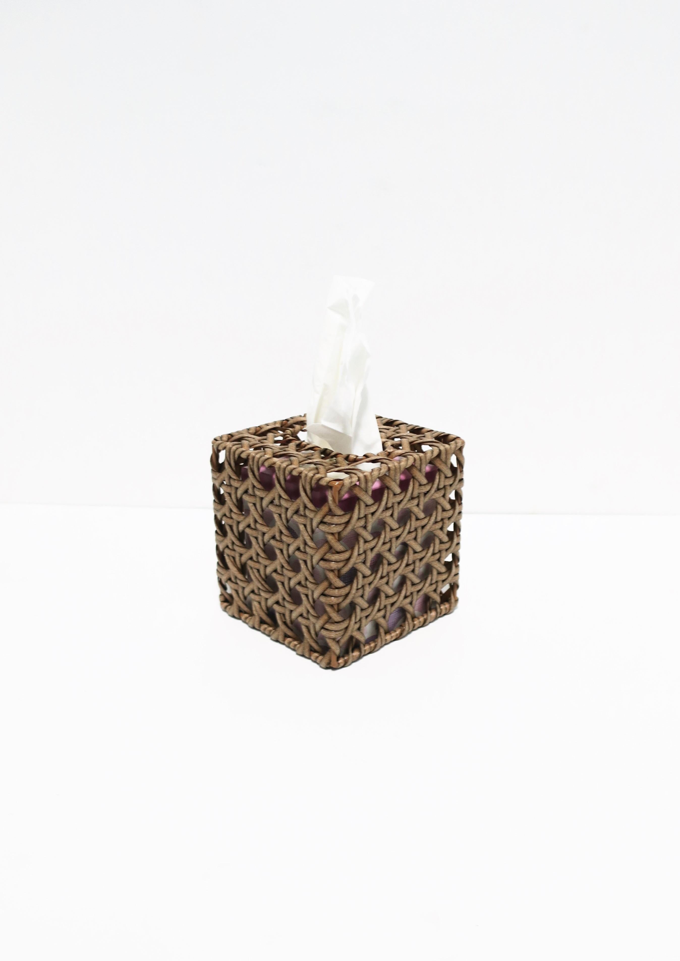 A contemporary wicker cane tissue box cover.