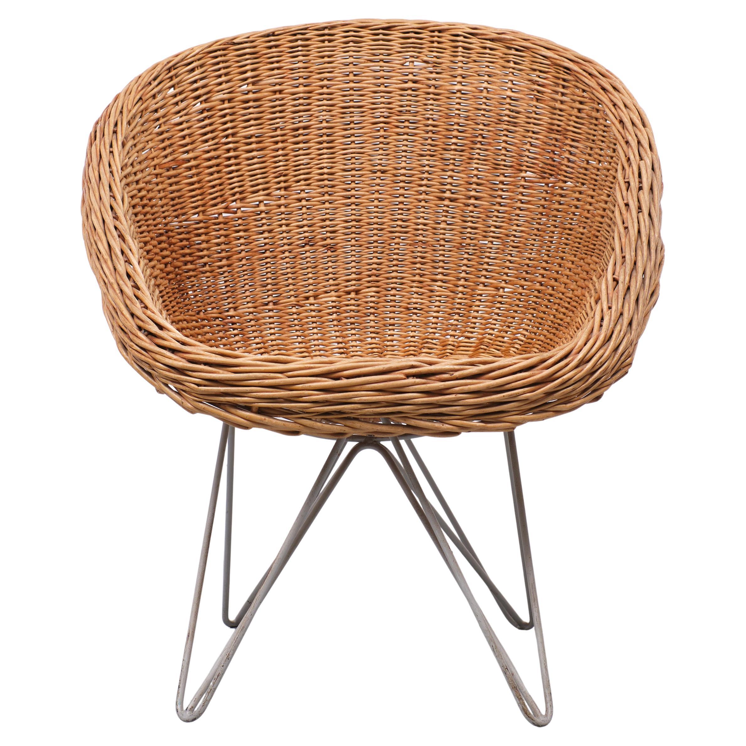 Very nice and rare Wicker chair .Design by Teun Velthuizen for Urotan 1950s Holland Grey Metal wire base ,comes with a Wicker seat .What a great looking chair this is
