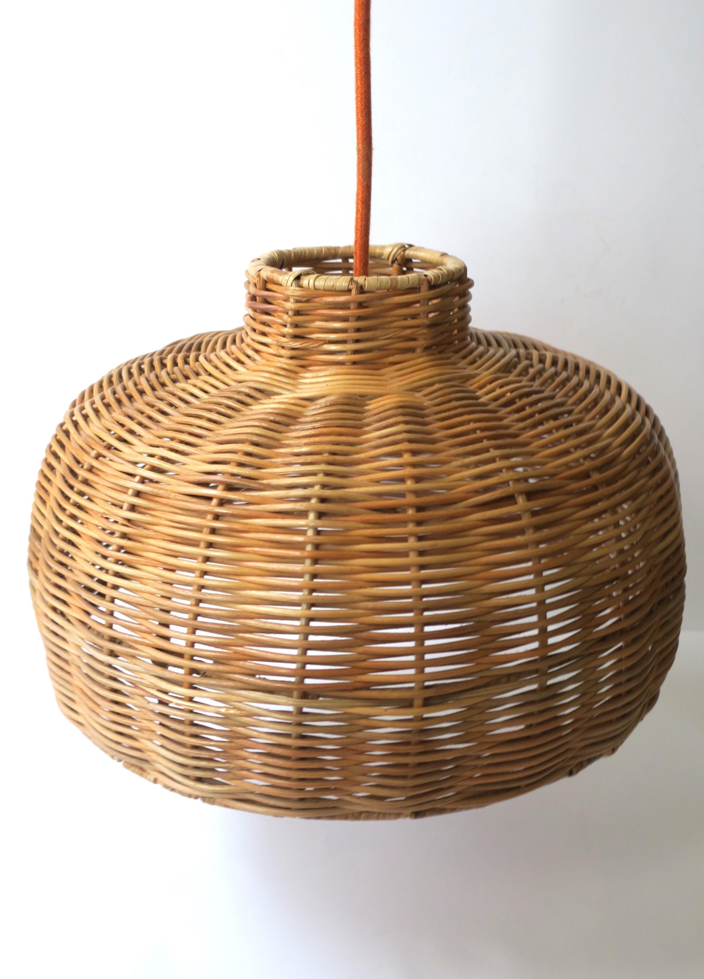 A round wicker chandelier pendant light with plug-in capability (to electrical outlet.) This round wicker chandelier pendant light supports one standard bulb, on/off switch on orange cord (as shown in last image) and plug-in to electrical outlet.