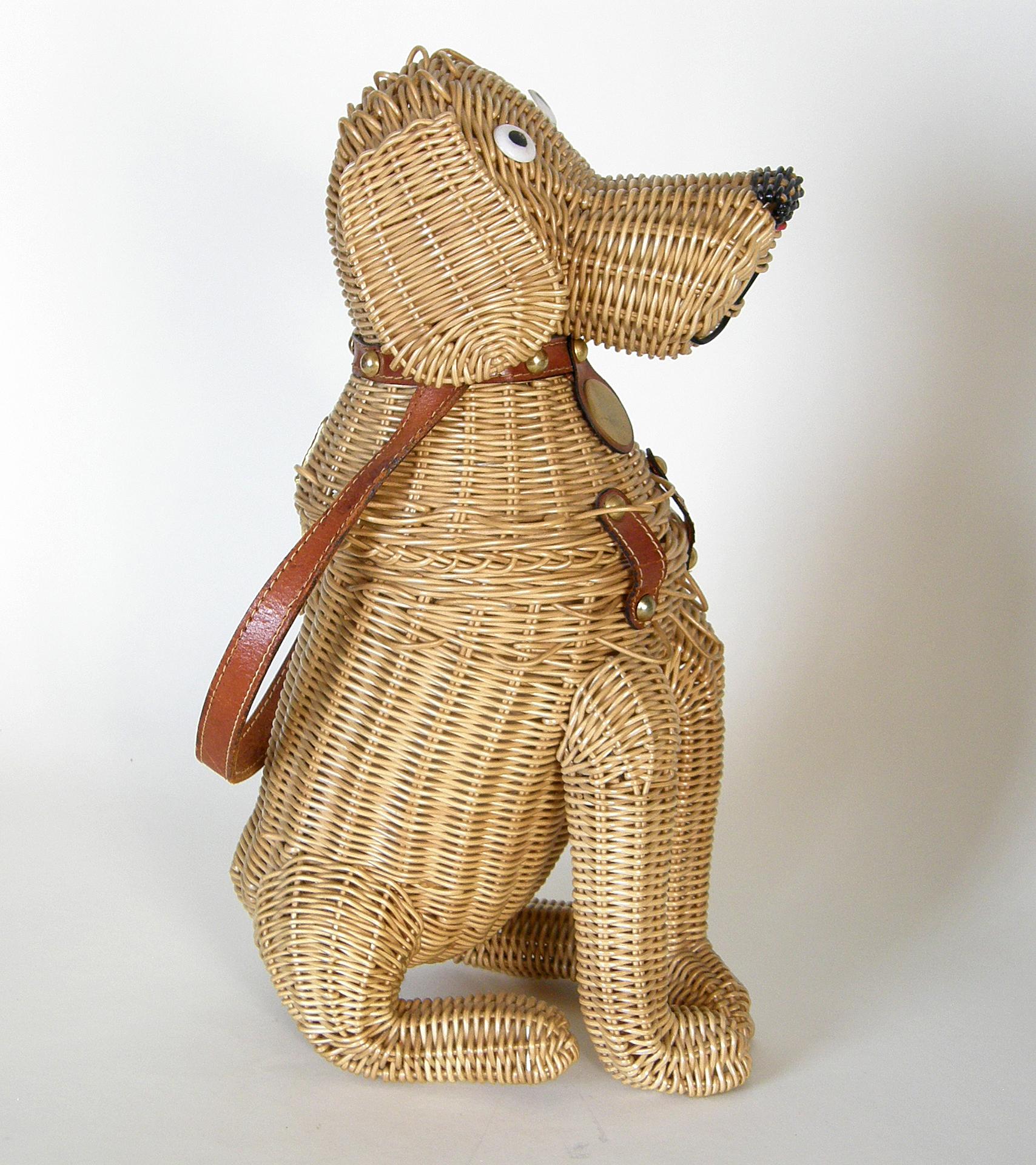 This handsome pooch is a wonderful example of a figural wicker handbag. He’s made of plastic coated wicker, which makes the wicker stronger and less susceptible to breakage. He’s tall and smiley, and sitting at attention like a good dog.

Of