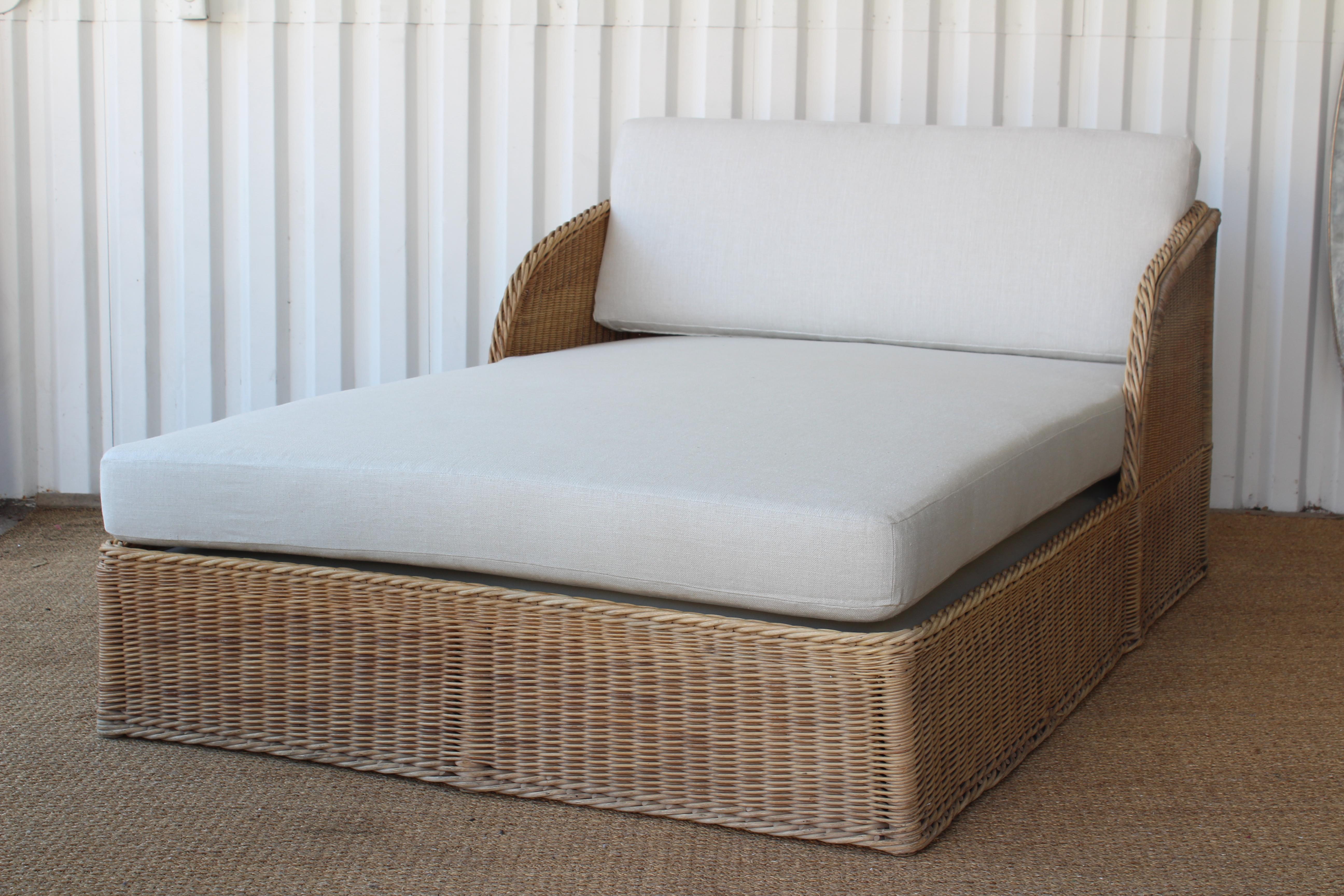 Large wicker double daybed by Michael Taylor, 1980s. New cushions in a neutral Belgian linen. Wicker is in good condition with some age appropriate wear.