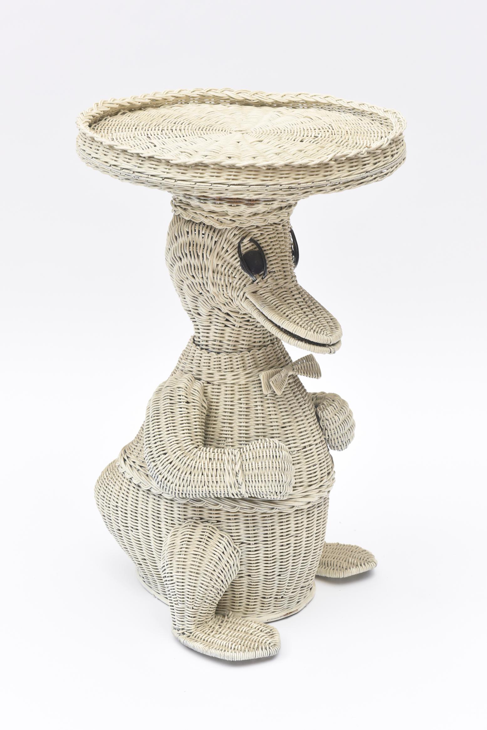 This precious duck with his bow tie and removable tray table top should make a baby or small child leap for joy. Created in the 1950s of wicker, he is the perfect addition to a nursery, bearing a resemblance to Donald, a favorite duck character