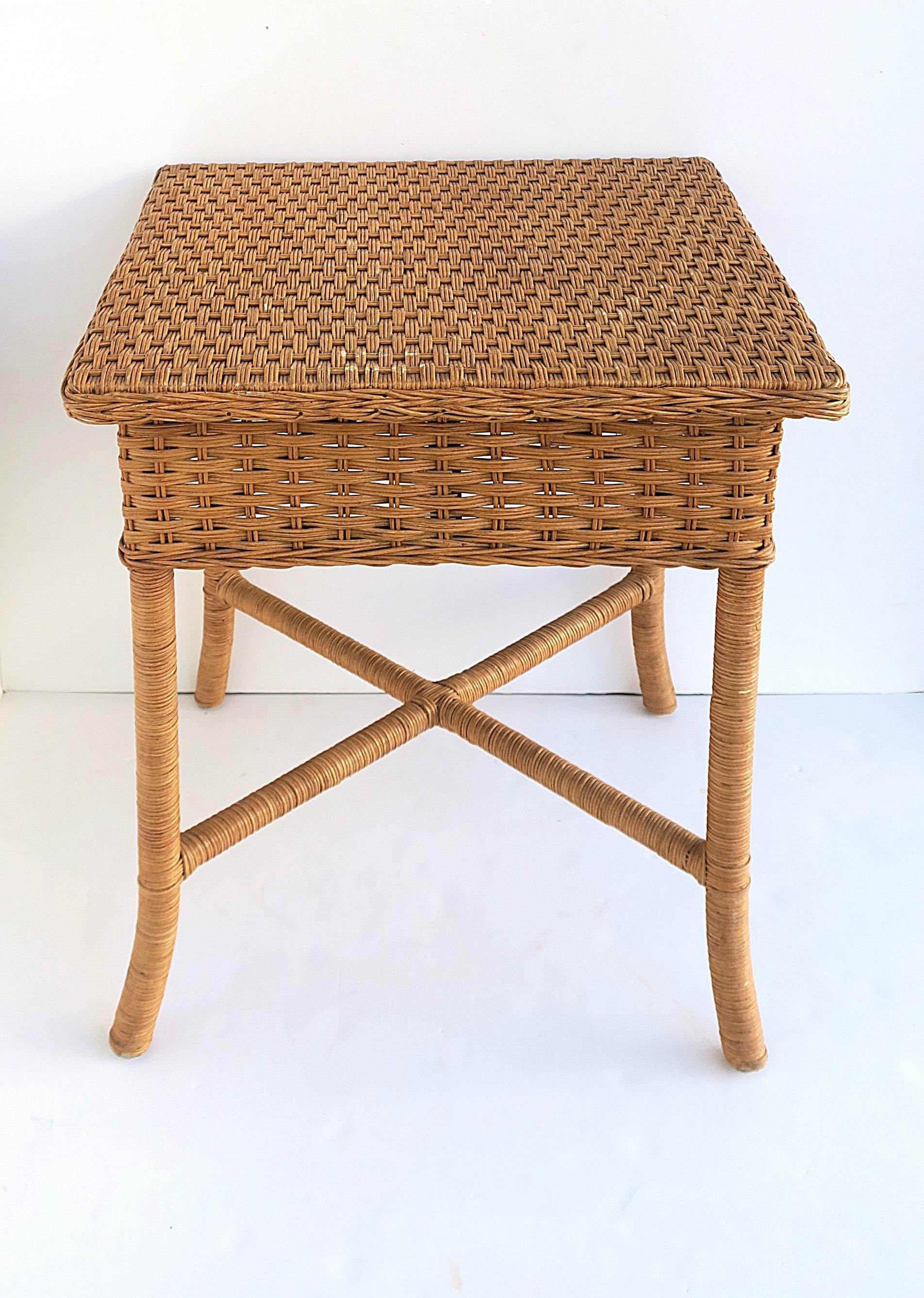 A wicker end table with stretcher 'X' base. A great piece as an end table to a sofa or in-between to chairs. Many uses. Dimensions: 21