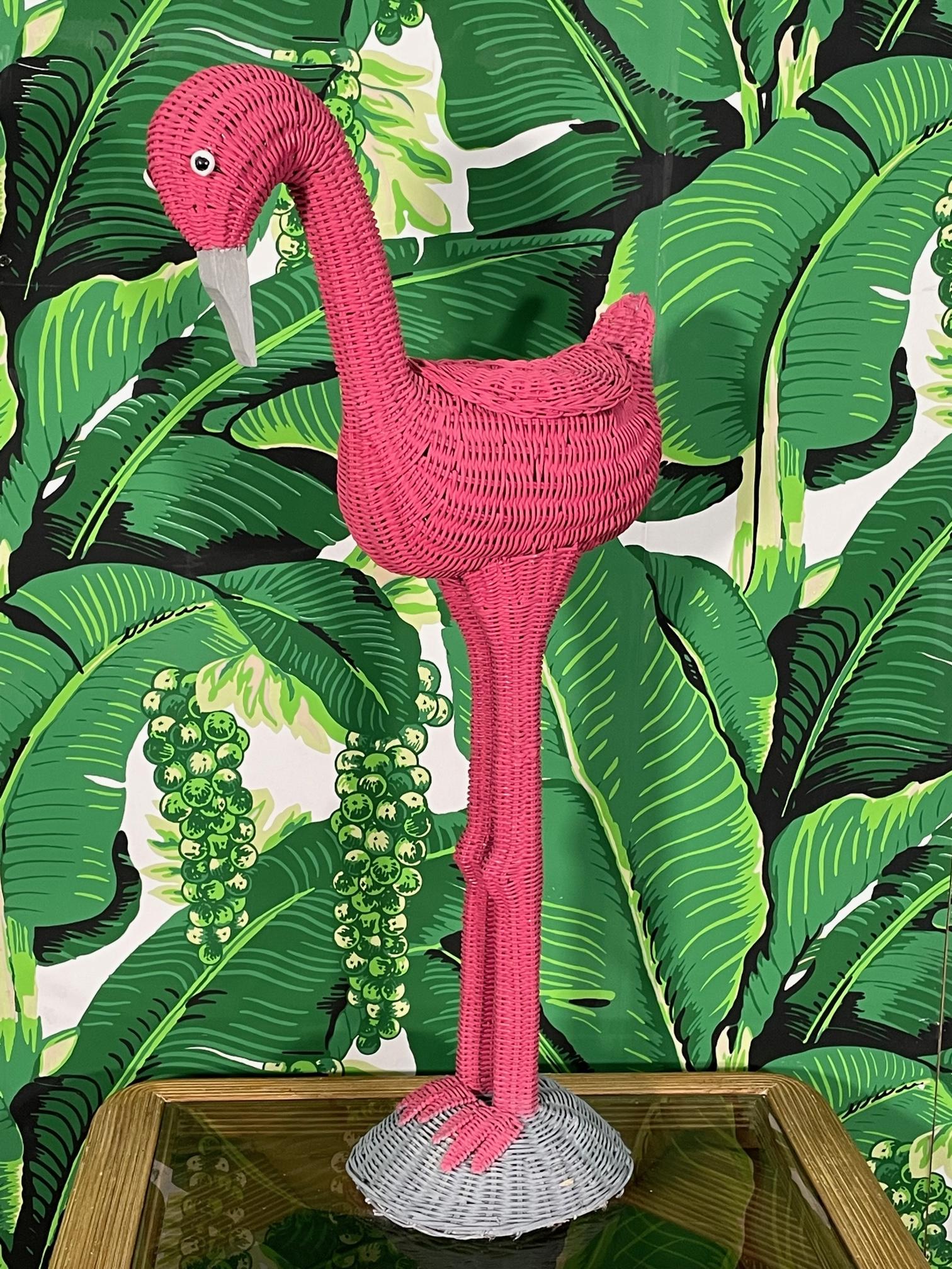 Super cute wicker flamingo has a built in bowl for use as a planter of other decorative ideas. Nice bright pick with a gray base. Good condition with minor imperfections consistent with age, see photos for condition details.
For a shipping quote to