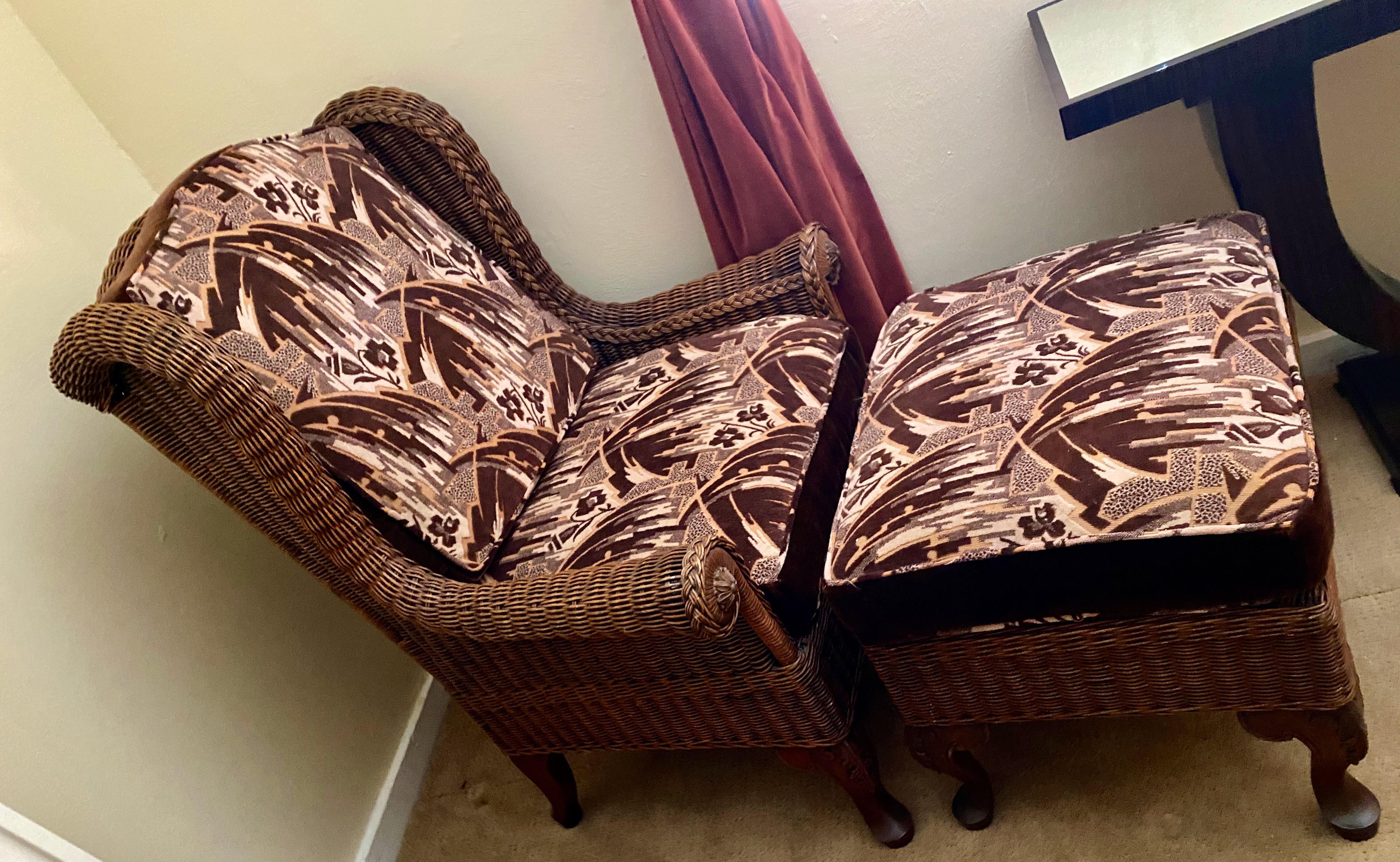 Wicker high back Art Deco lounge chair and stool with original Art Deco fabric. Quality wicker vintage style possibly made by McGuire with high shaped back, interesting rounded arms, and over high quality. Set has a matching footstool also. We had