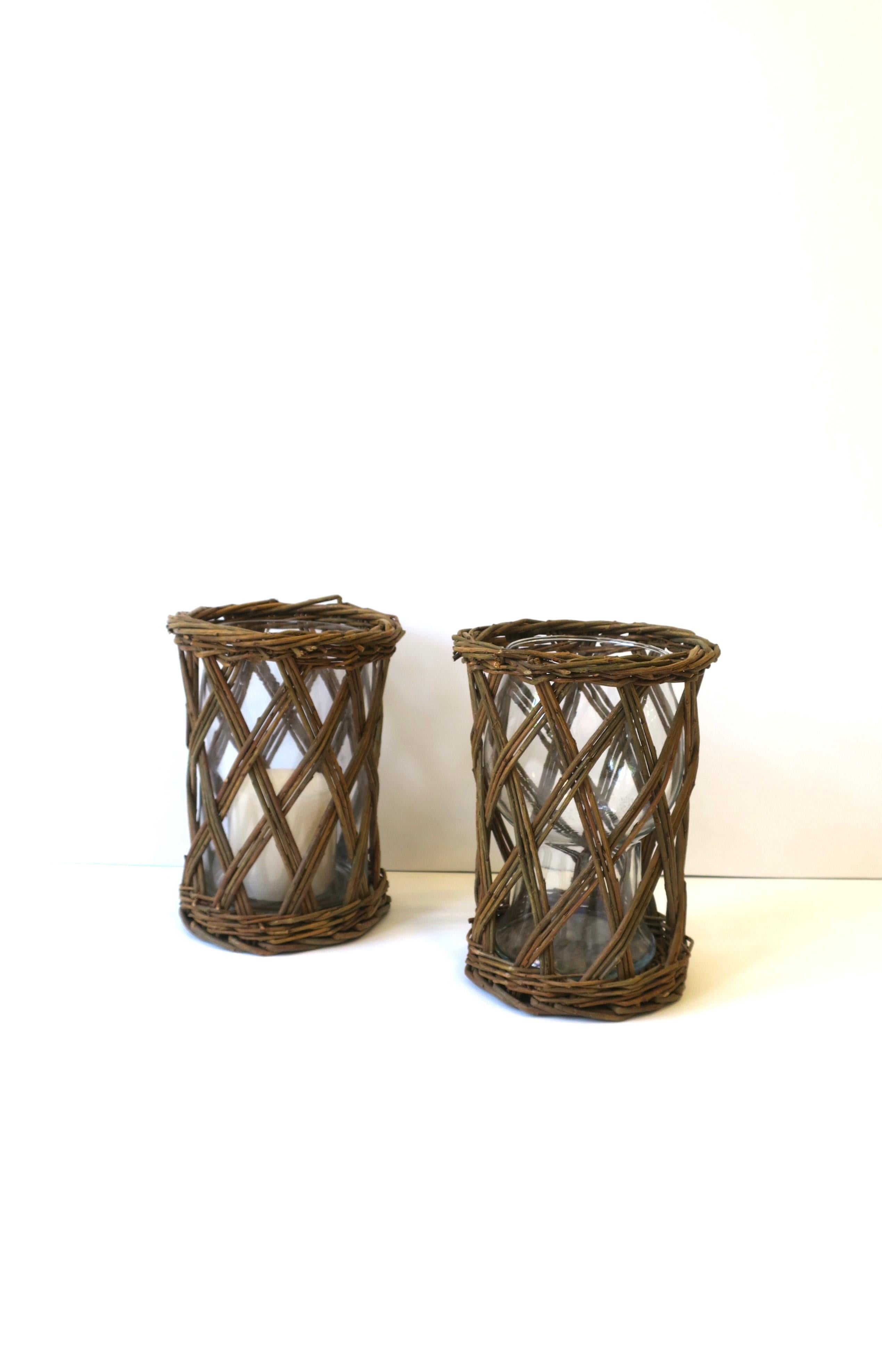 Wicker and Glass Hurricane Candle Lamps, Pair In Good Condition For Sale In New York, NY