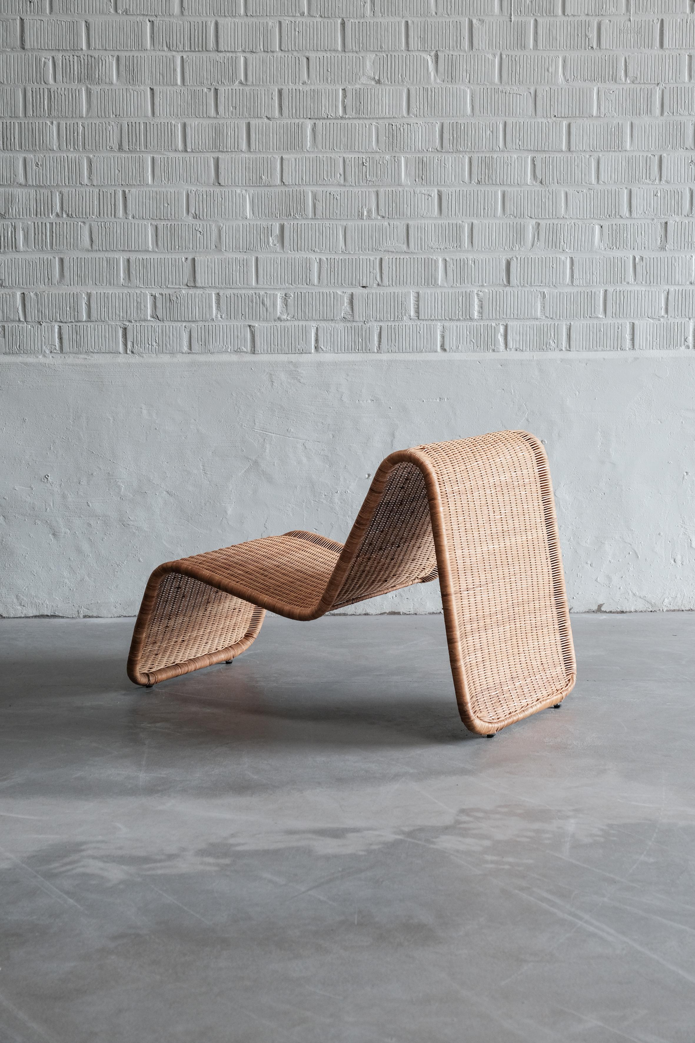 Wicker lounge chair in the manner of Tito Agnoli, 1970 Italy.