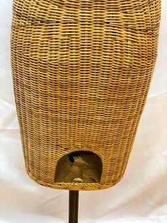 Wicker mannequin on iron stand