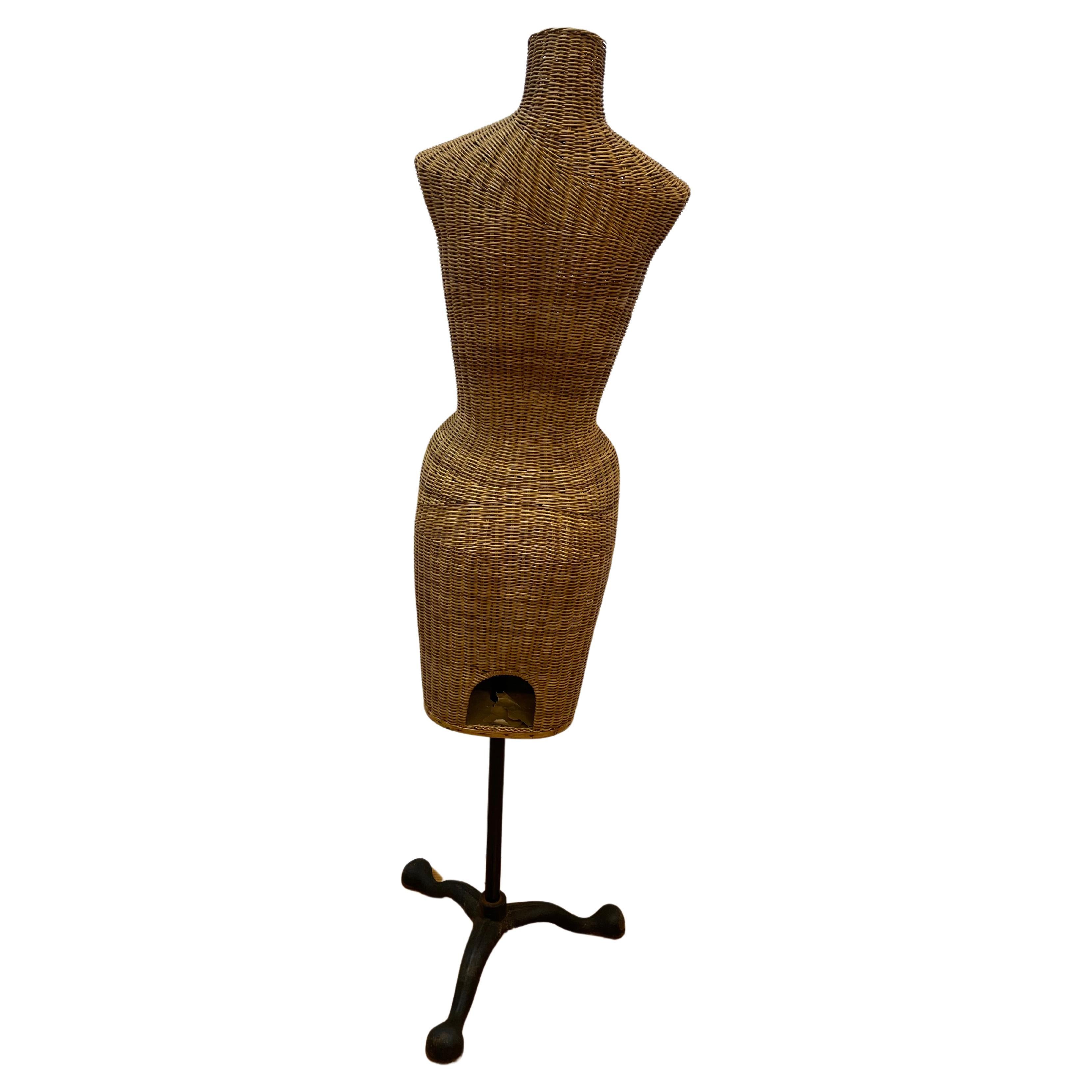 Wicker mannequin on iron stand 