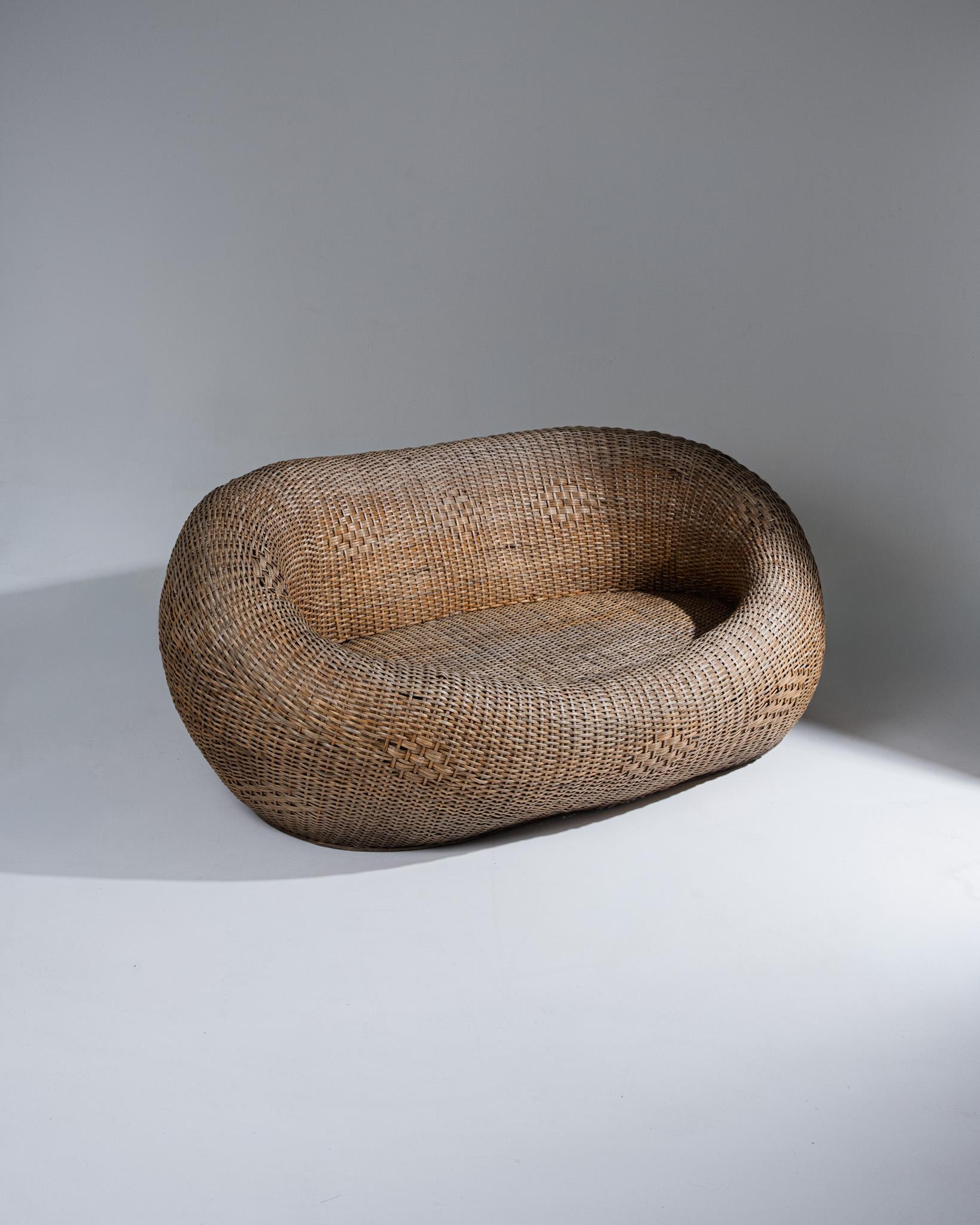 Wicker Sofa with Rounded Form, 1960s–1970s

Wicker outdoor sofa featuring a rounded silhouette typical of the 1960s–1970s. Fine handwoven work with natural patina, light fading, and minor surface wear consistent with age.
DV4598
