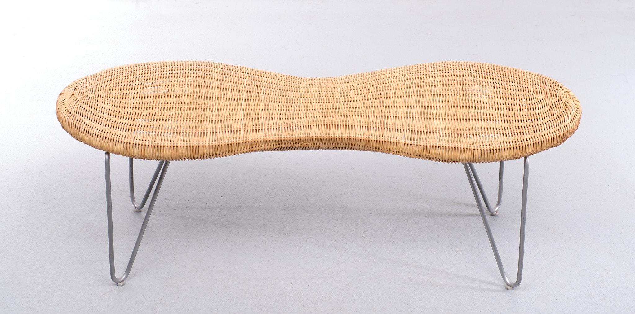 Love this Wicker Peanut stool . Made for Ikea in the 1980s  Very rare bench . 
Metal u shaped folding legs . Comes with a organic Wicker top . With  the shape  
of a Peanut . Great looking piece . 