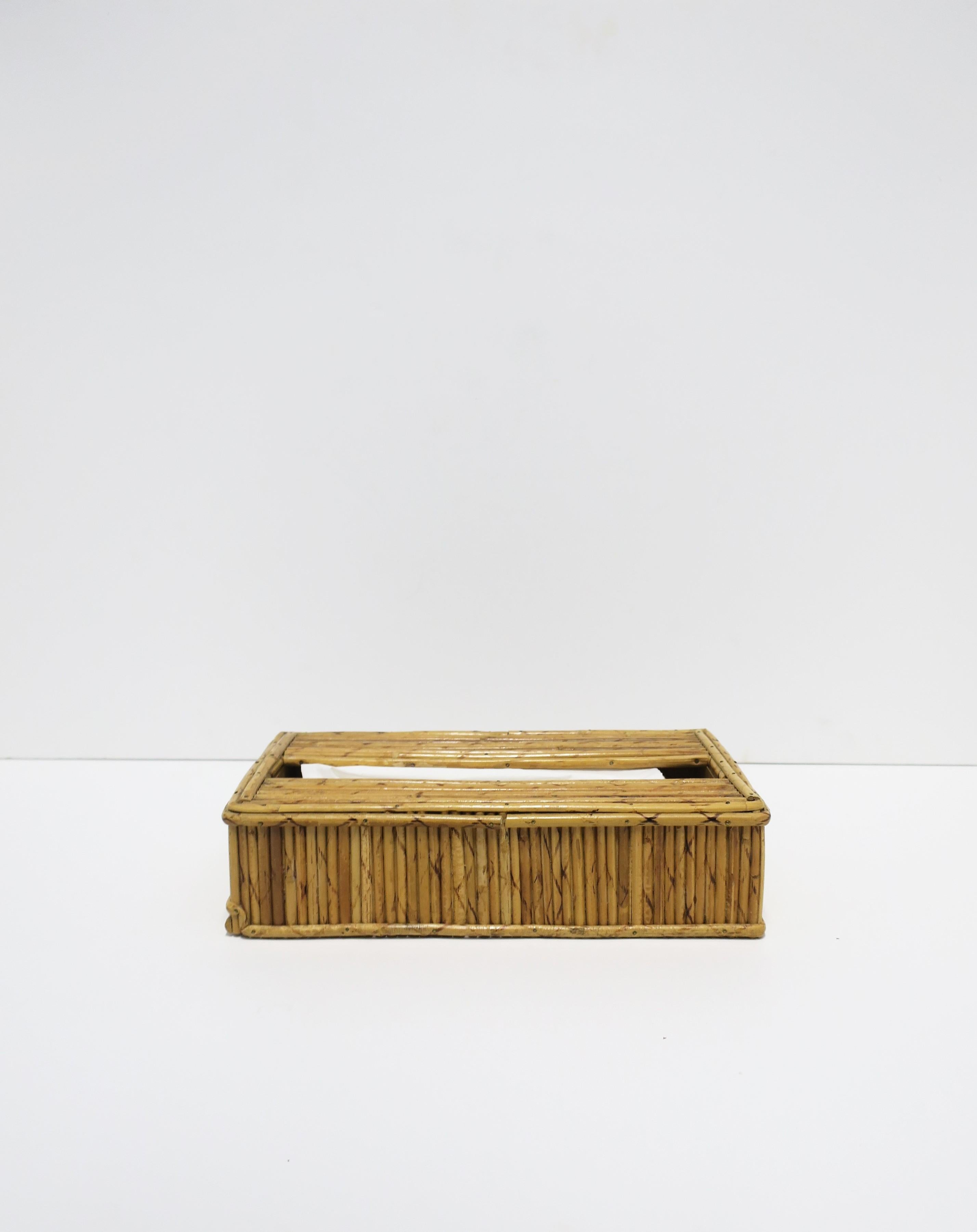 A Modern wicker pencil reed tissue box cover holder in the design style of designer Gabriella Crespi, circa 1960s, 1970s, English ruled Hong Kong. A great piece of any bathroom, office, library, bedroom, pool house, etc. Fits standard size tissues