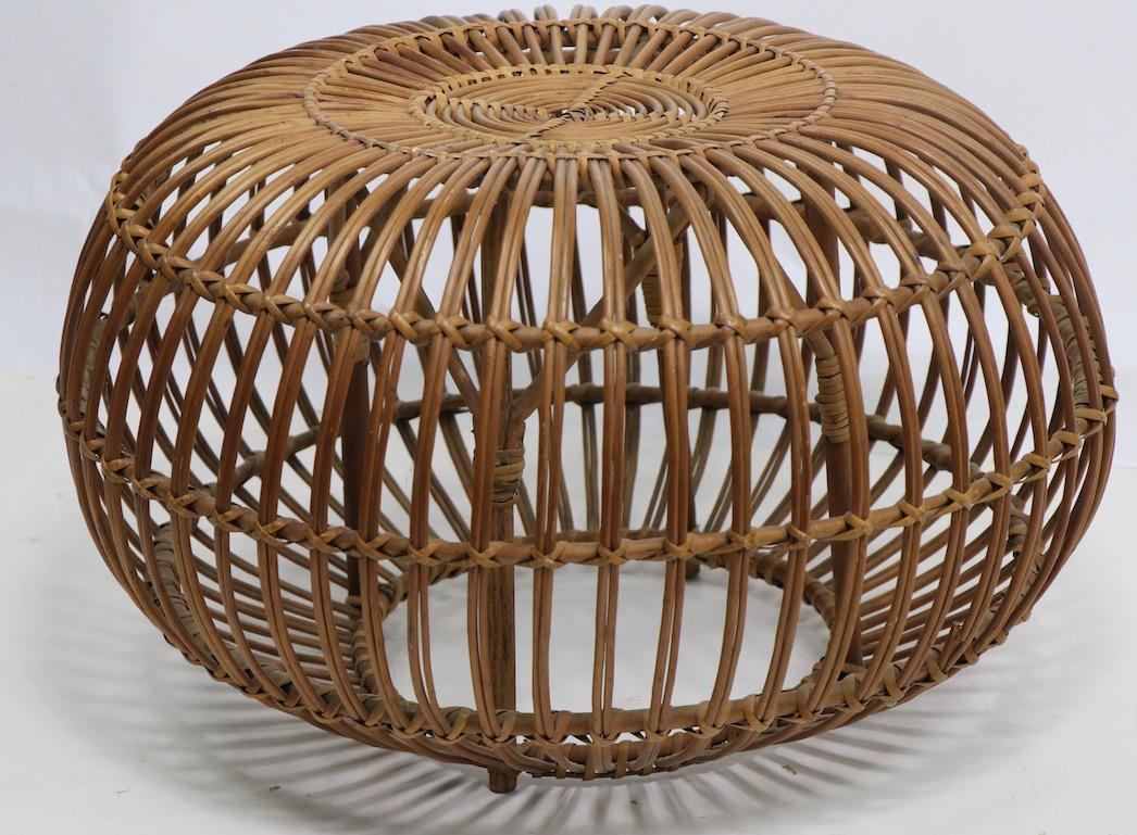 Stylish wicker, rattan pouf, ottoman by Albini. This example is in clean, original condition. Please view the companion ottoman we have listed separately. This listing is for one ottoman only.