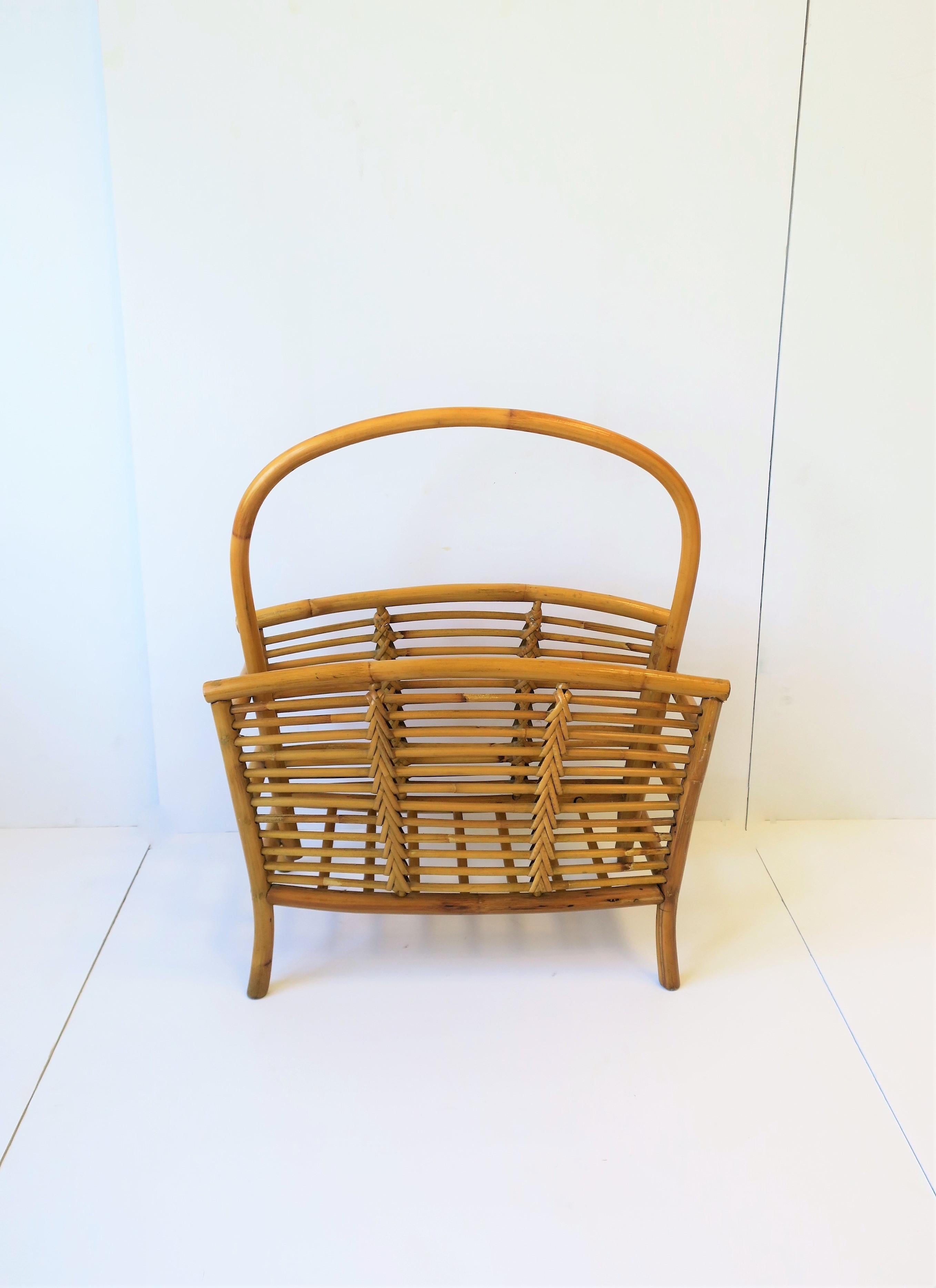 A rattan wicker magazine holder stand, circa mid-20th century. Piece has two storage compartment areas to hold magazines, newspapers, papers, books, etc. A great addition to an office, library, den, pool house, etc. Very good condition as shown in
