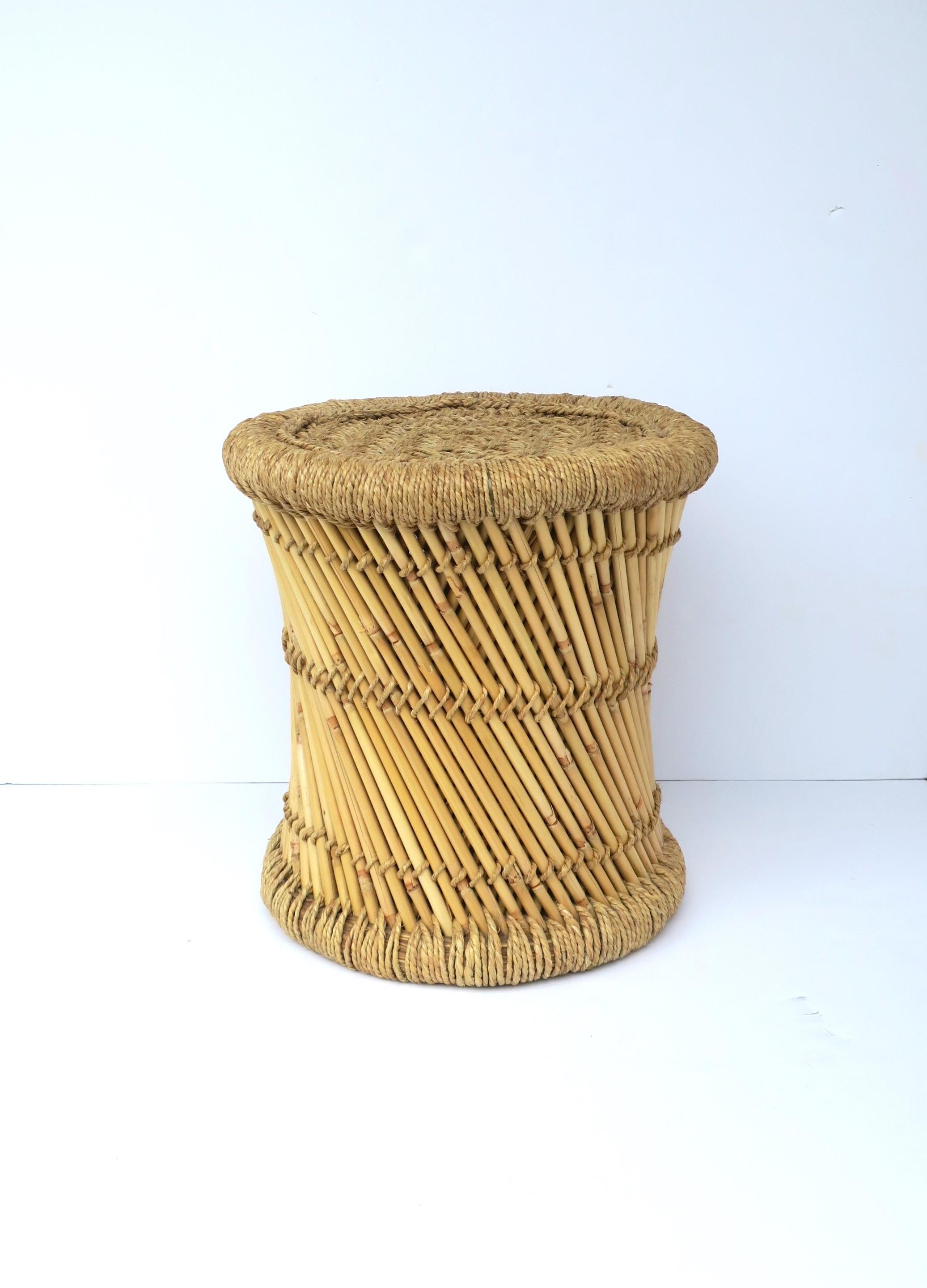 A blonde wicker pencil reed stool in the Anglo Raj style. Stool is sturdy and well-made and can support a human being (as intended.) Stool can also double as drink table (providing there's a stable environment on top, e.g. a book), or hold/display