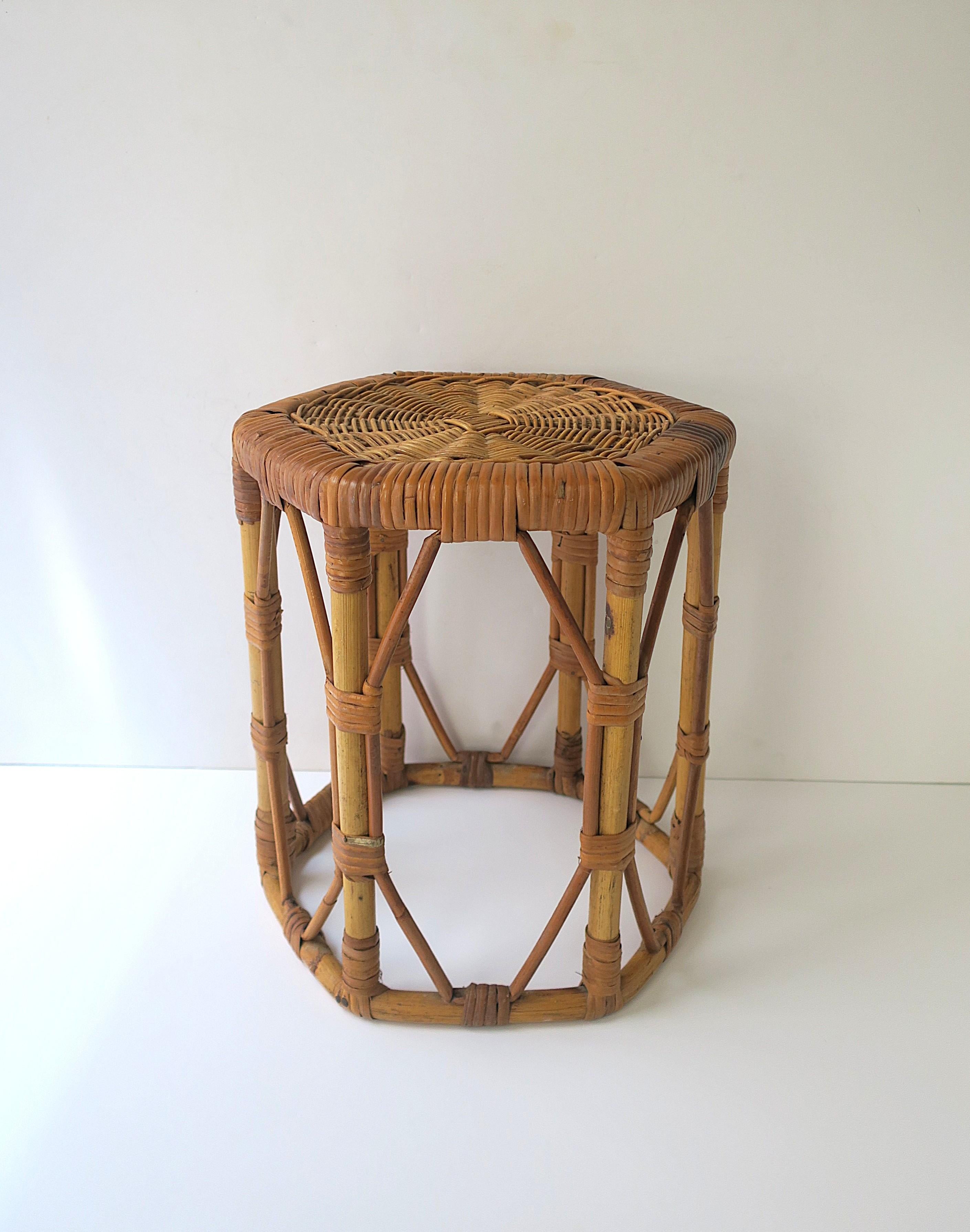 A wicker bamboo stool or side/drinks table, with hexagon top/seat, circa mid-20th century. Use as stool, side/drinks table, plant stand, etc. Indoors, patio, bathroom, etc. A great piece with many uses. 