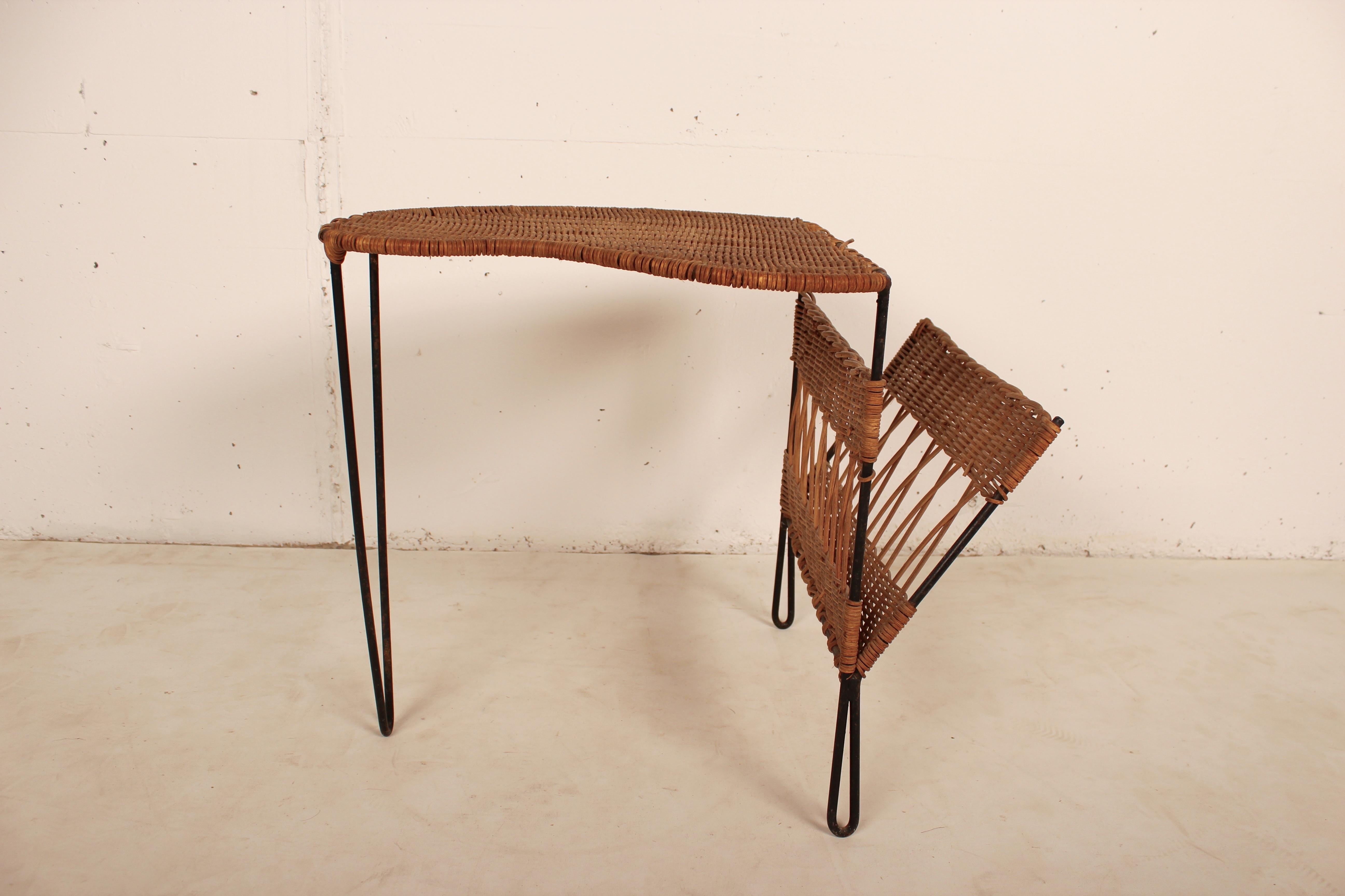 Wicker and black metal side table with magazine holder by Raoul Guys, France, 1950.