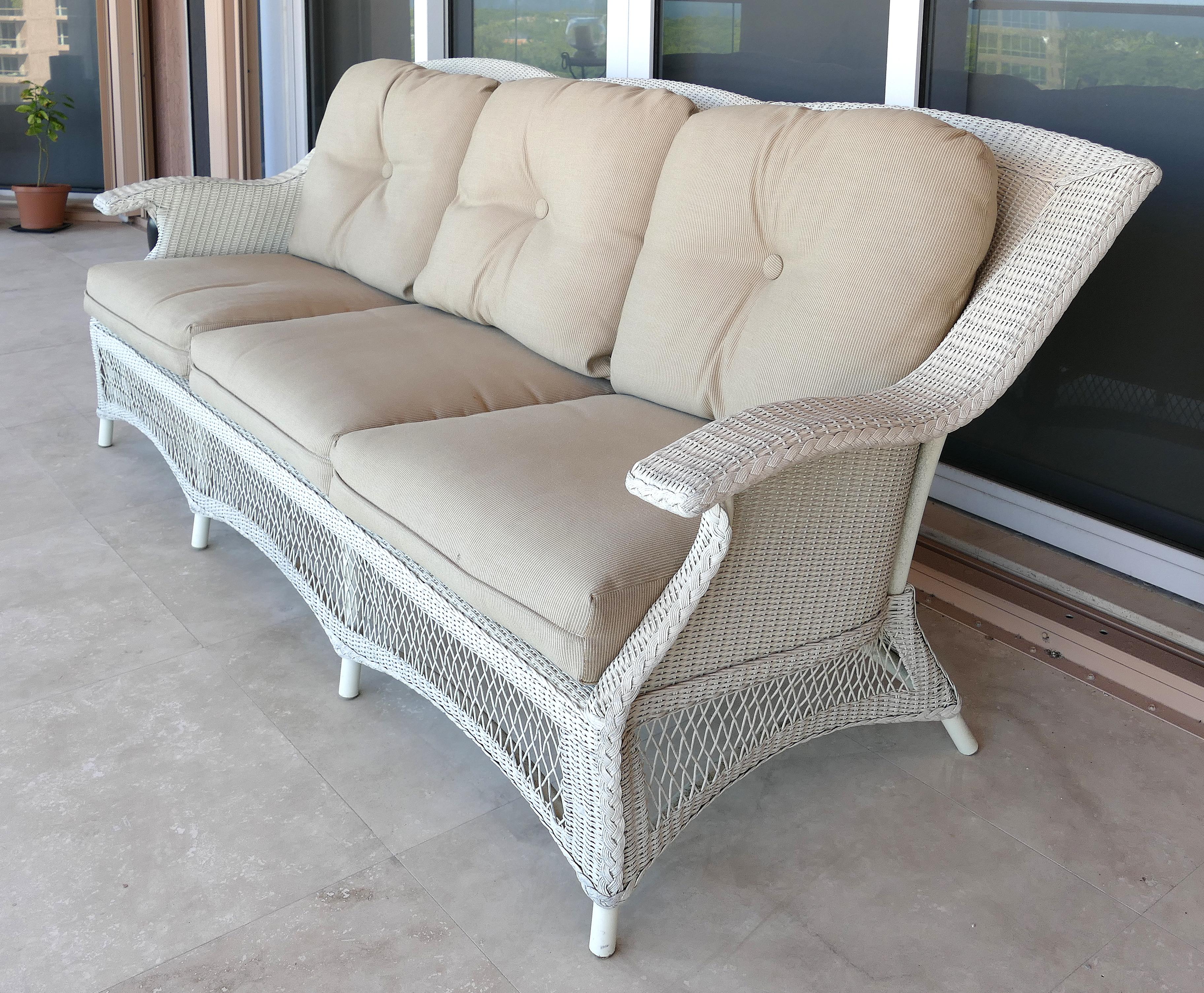 Traditionally Styled Wicker Sofa

Offered for sale is a modern woven wicker furniture 3-seat sofa with loose cushions. The traditionally styled sofa is reinforced with metal framing which supports the wicker. The sofa has been kept out of the
