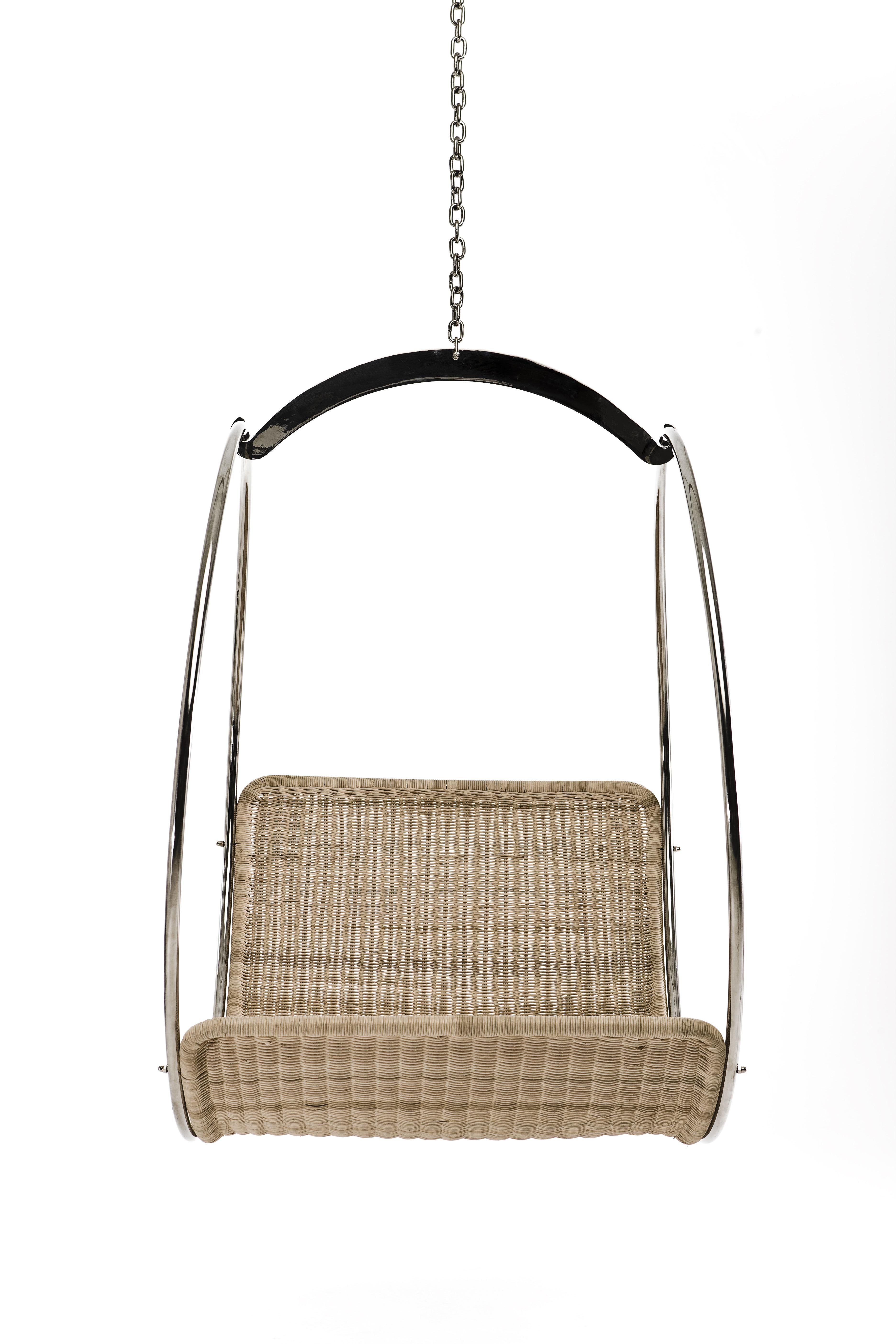 Leather Swing Chair by Egg Designs
Dimensions: 100 L X 80 D X 110 H cm 
Materials: Polished Stainless Steel, Synthetic Wicker

Founded by South Africans and life partners, Greg and Roche Dry - Egg is a unique perspective in contemporary