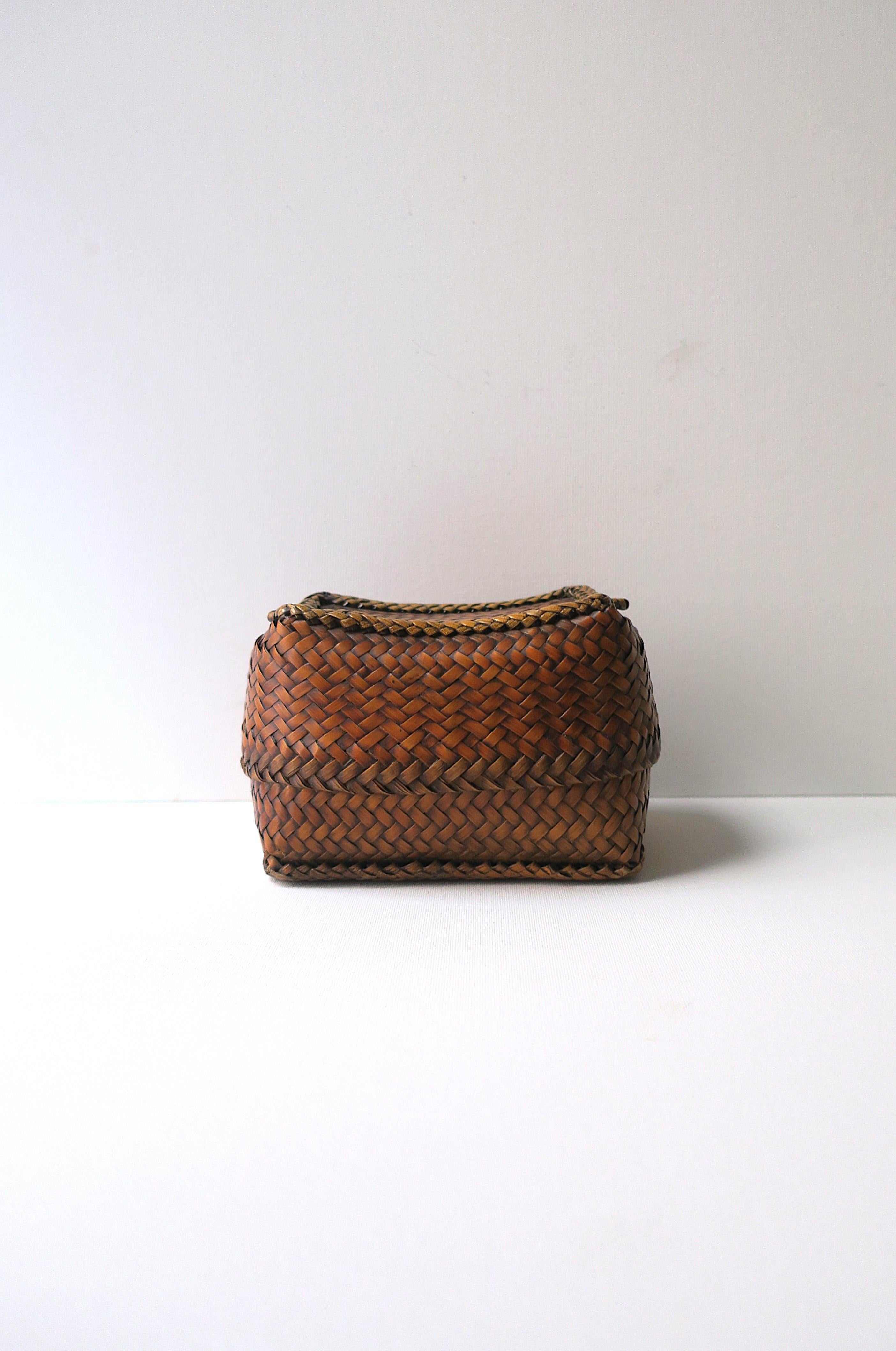 A beautifully weaved wicker basket box. Great to hold small items or as a decorative object. Shown holding cotton balls. Many uses. Dimensions: 4.13