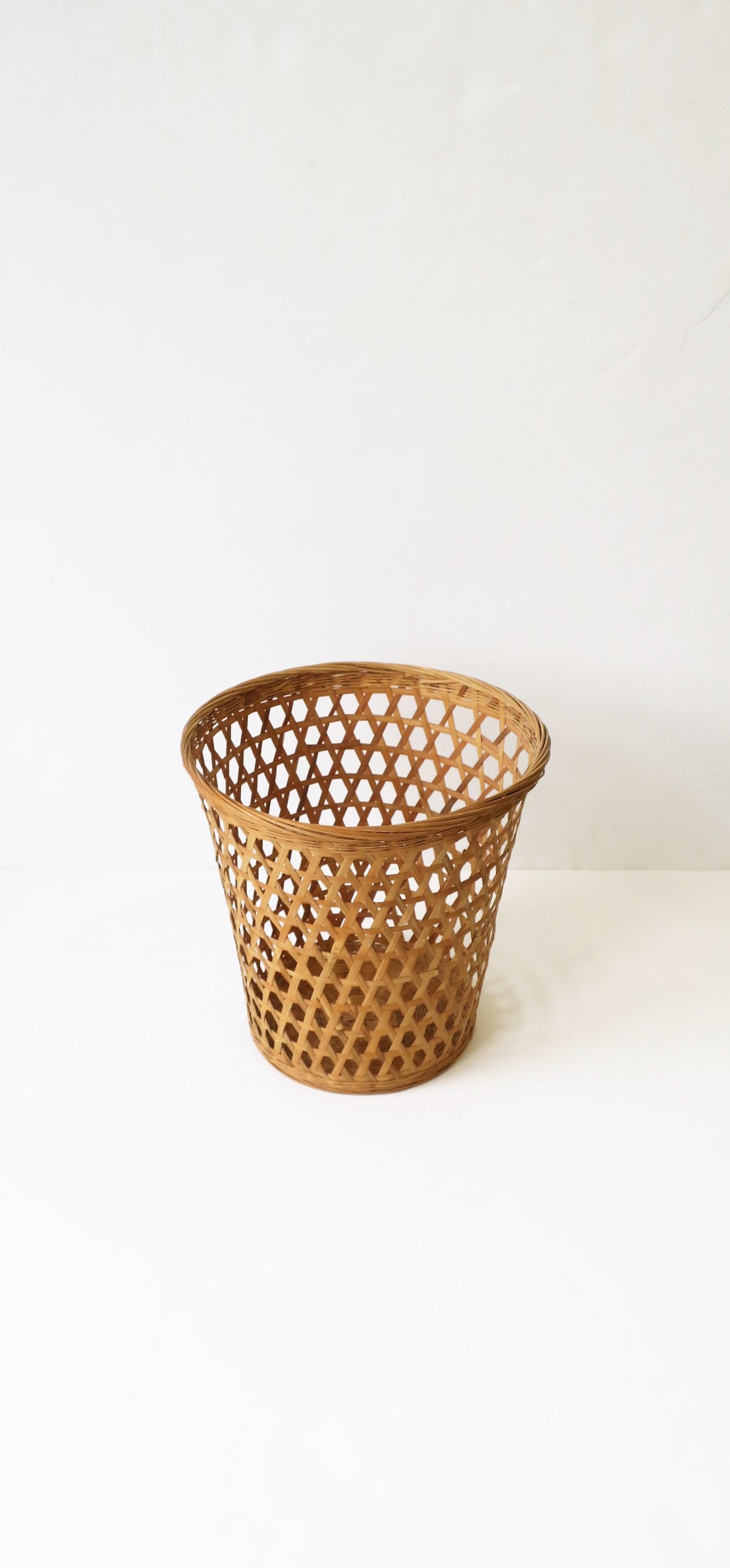 A great wicker wastebasket or trash can, circa mid to late 20th century. Piece could work well in any room in the house including an office, library, bathroom, bedroom, etc. 

Dimensions: 7.5