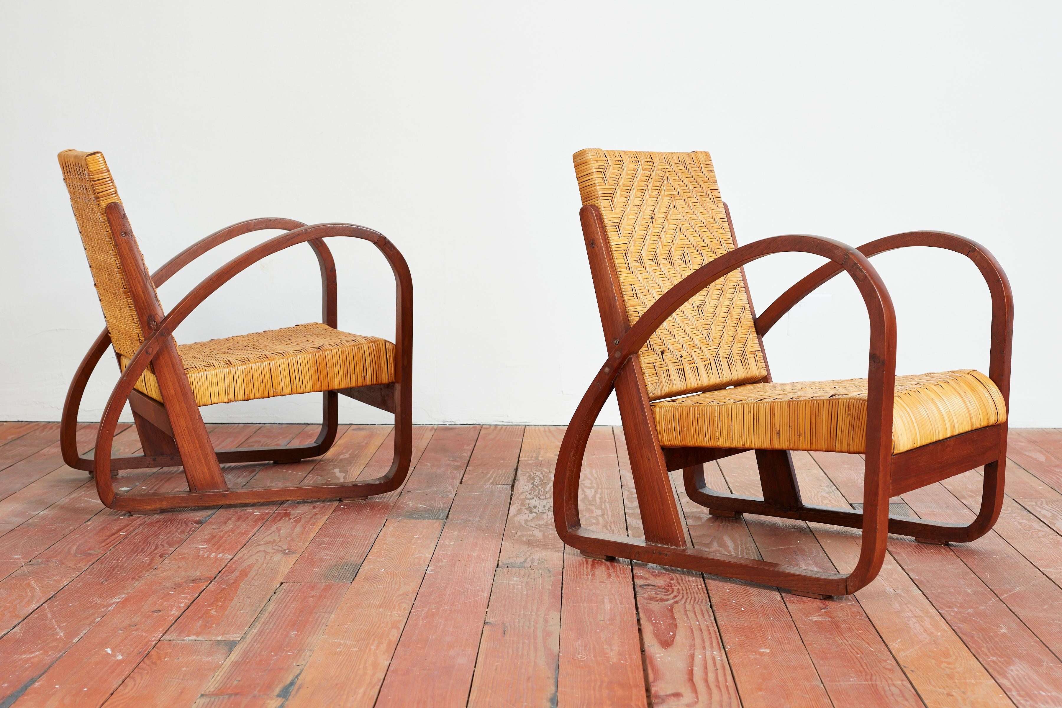 1940s Italian pair of chairs with patterned wicker seat and back in the style of Paolo Buffa. 
Angular wood frame in loop shape with wonderful original patina.
Matching settee available - sold separately.