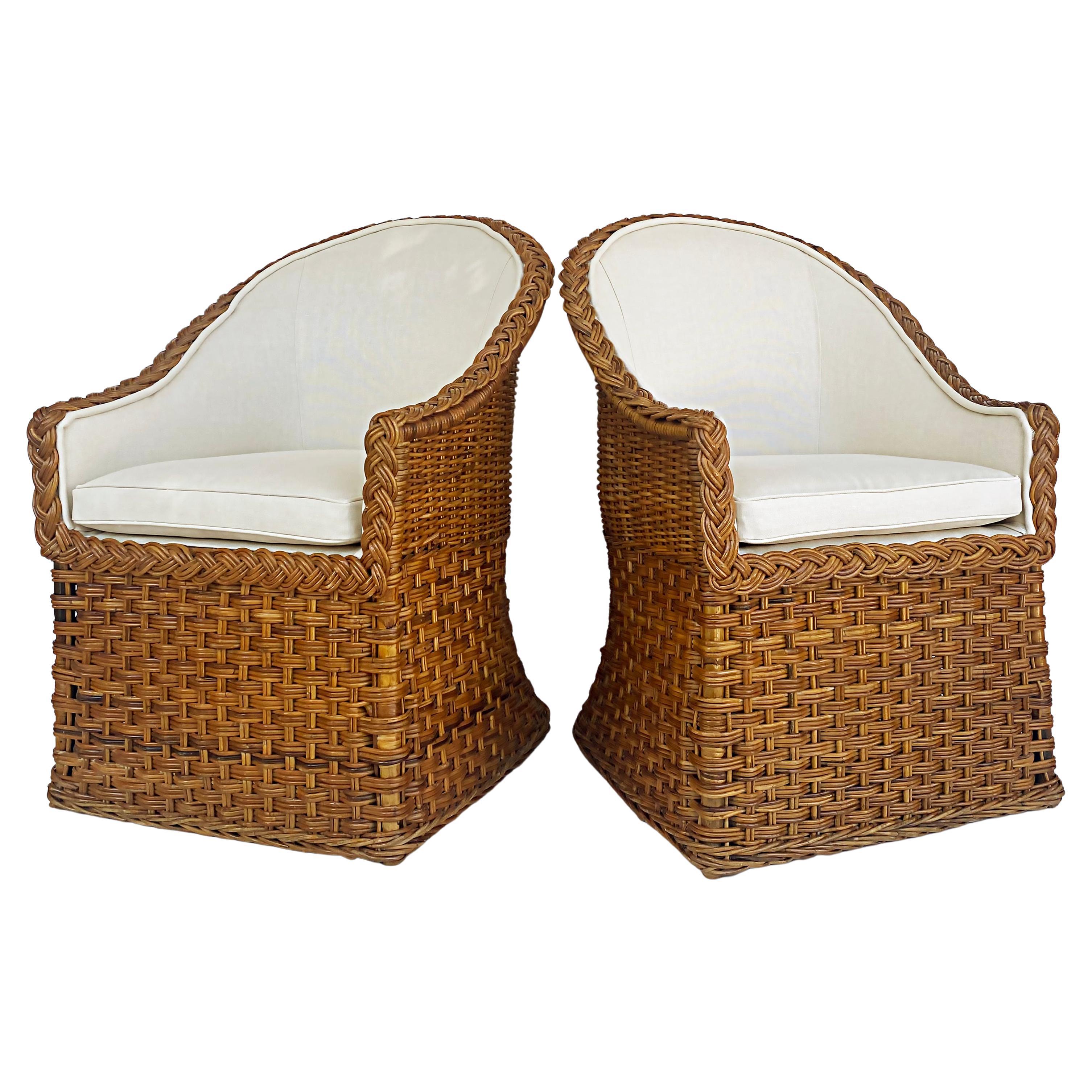 Wicker Works Braided Rattan Club Chairs, New Upholstery, 1 Pair Available

Offered is one pair of Wicker Works braided rattan club chairs which have been newly upholstered. These wonderful coastal chic chairs have the typically braided rattan