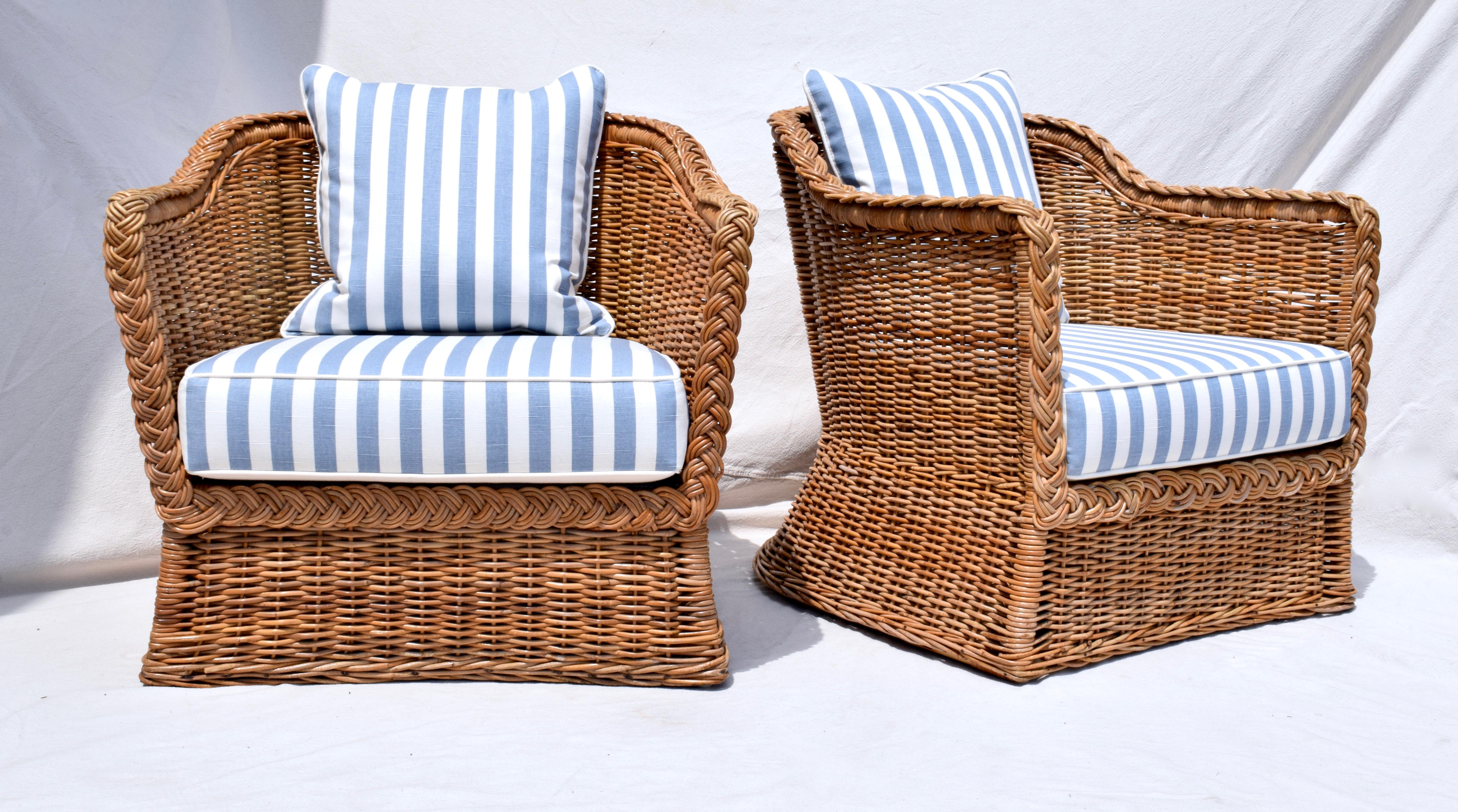 Exceptional pair if 1960's Wicker Works of San Francisco braided wicker rattan armchairs with new custom seat cushions, deck & goose down back cushions upholstered in new stock vintage Ralph Lauren sky blue and white cotton linen. Seats: 16