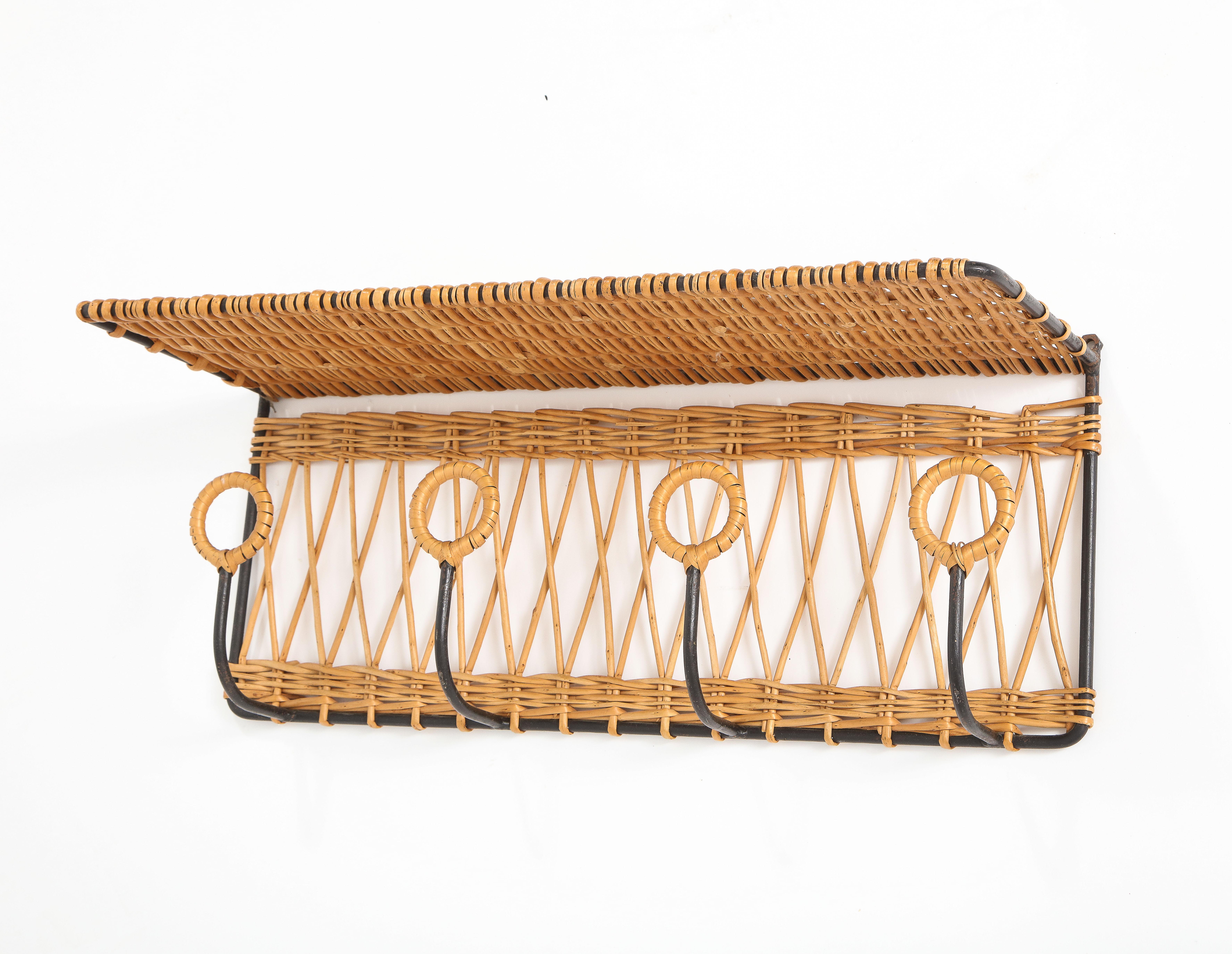 A combination shelf and coat rack, wicker wrapped wrought iron.