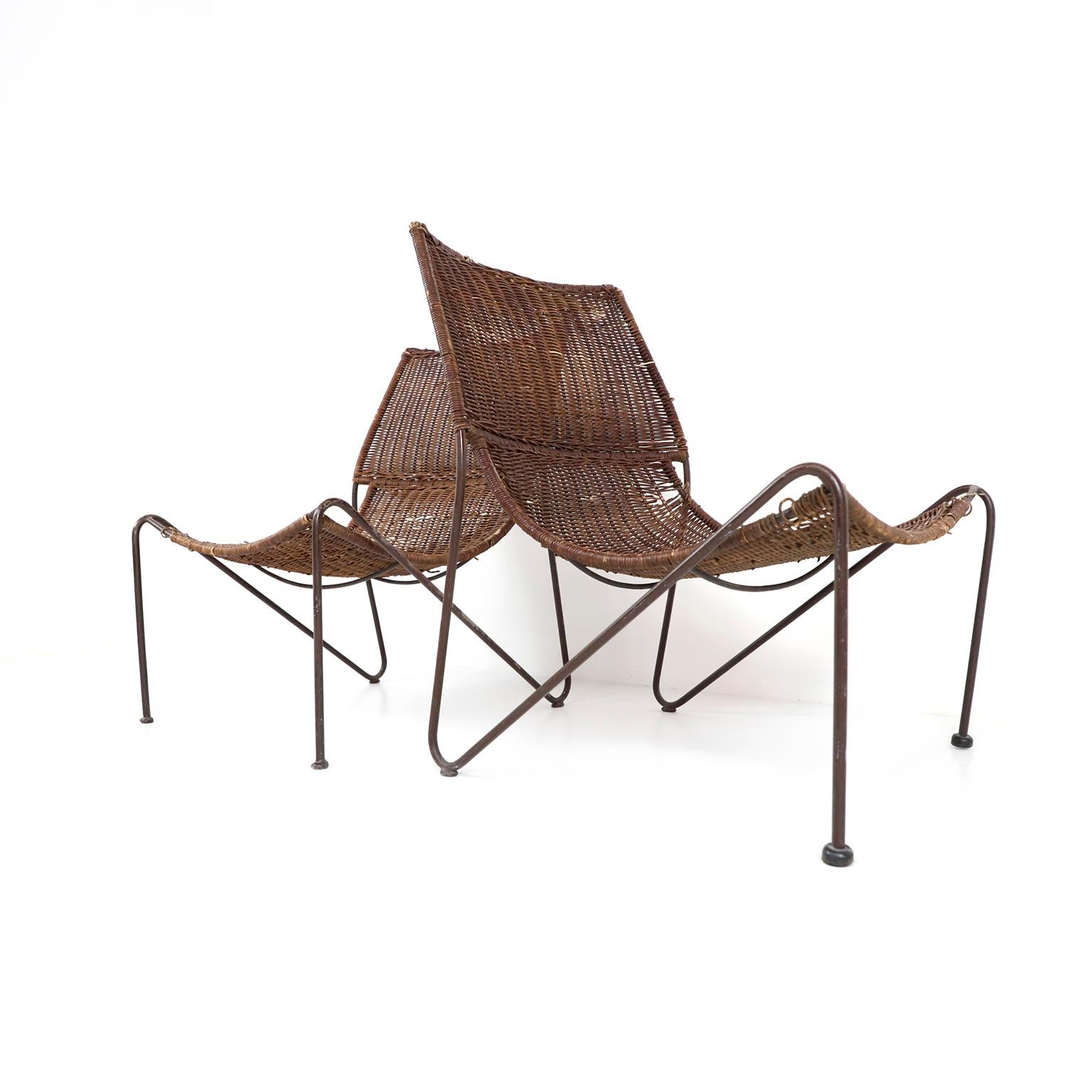 Mid-century style wicker & wrought iron lounge chairs in the manner of Frederick Weinberg.