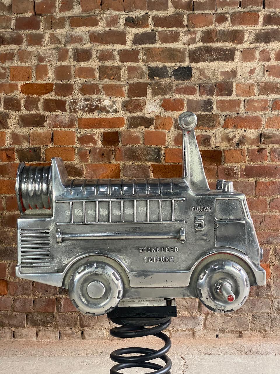 Wicksteed fire engine child’s fairground rocker Circa 1950 

Magnificent mid twentieth century wicksteed fire engine child’s spring rocker, England circa 1950, the fire engine brandishing the Wicksteed Leisure / Tower 5 name to the sides, with