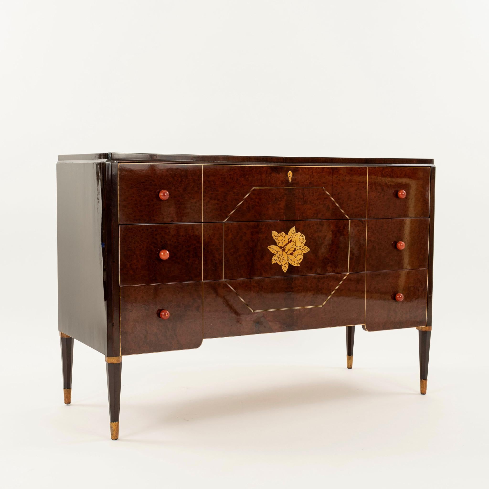 Lacquered Widdicomb three drawer burl walnut chest with brass inlay detail.