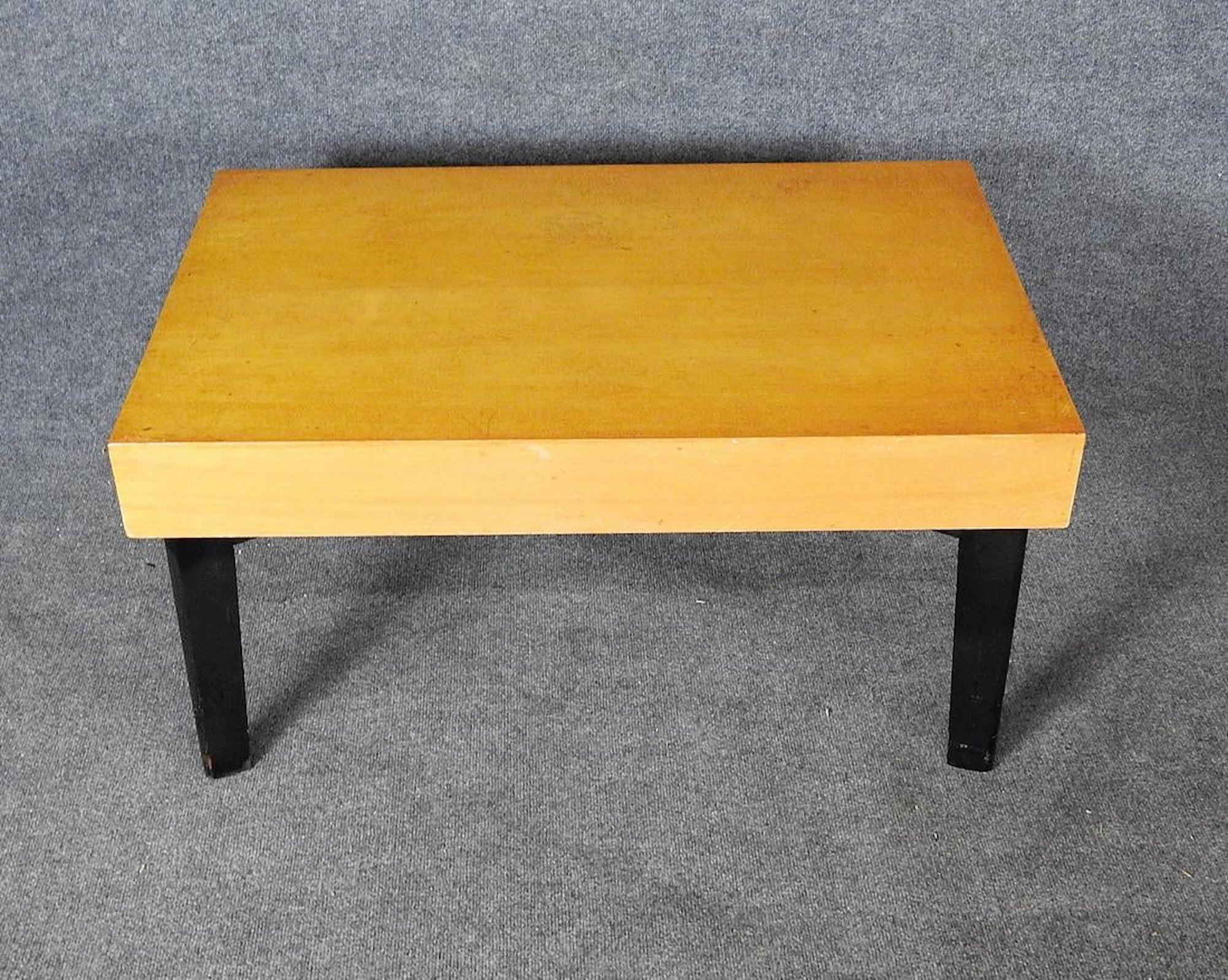 Robs John Gibbings table with extension storage. Blonde veneer with black legs.
Size: Each extension 17