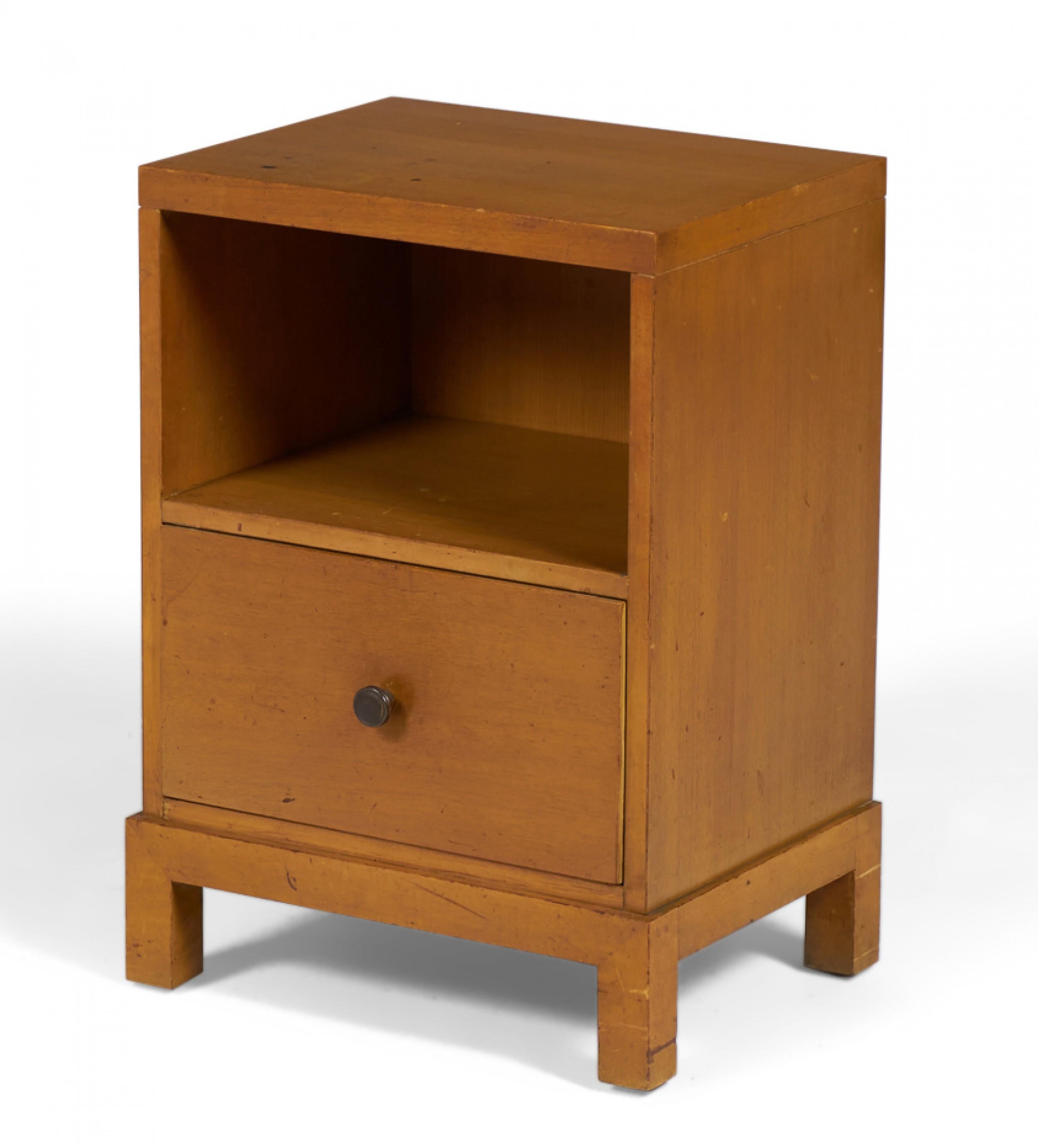 American mid-century (1950s) walnut nightstand with an open upper cabinet and a lower drawer with a circular metal drawer pull, resting on a square Chinese-style base. (WIDDICOMB MODERN)(Similar pieces: DUF0145A-C)
 