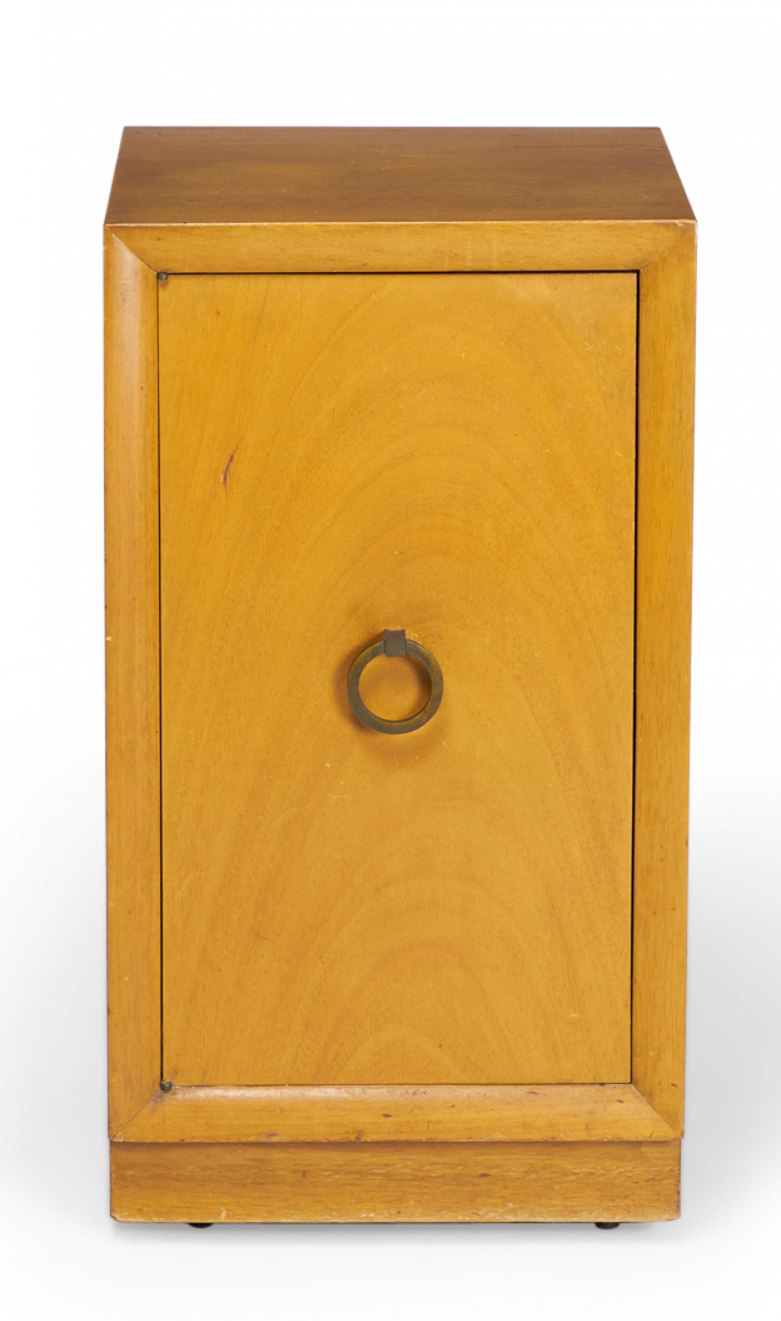 American mid-century blond maple nightstand / tall cabinet with a single compartment concealed by a hinged door with a bronze ring door pull. (WIDDICOMB MODERN)(Similar cabinets: DUF0149B, DUF0149C)
 