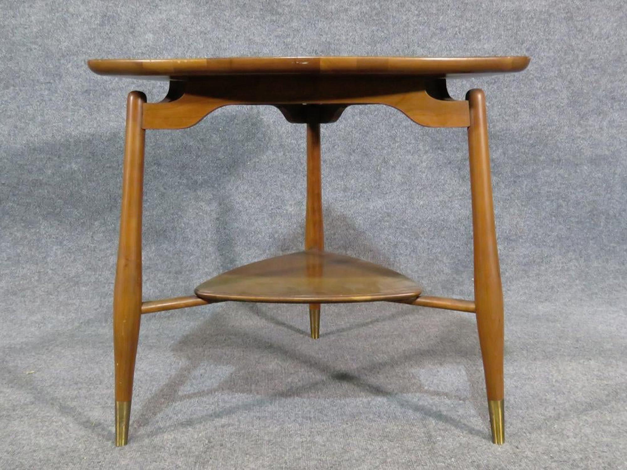 Walnut end table with sculpted sides and bottom shelf made by John Widdicomb.
(Please confirm item location - NY or NJ - with dealer).
  