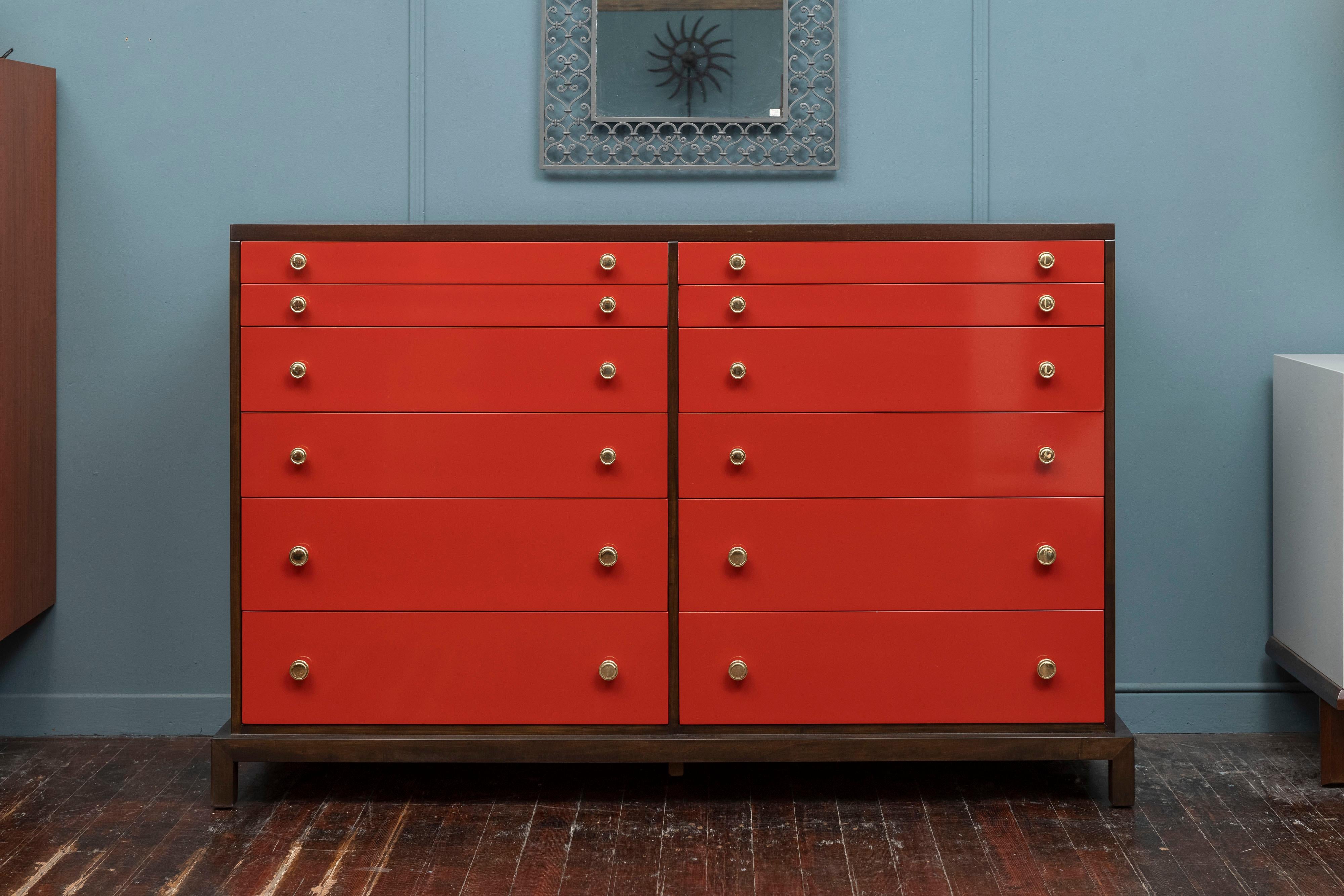 Widdicomb tall double dresser with twelve drawers fitted with dividers for organization. Newly refinished mahogany case in a expresso walnut semi-gloss finish and Chinese red lacquered drawers. All brass pulls have been professionally polished and