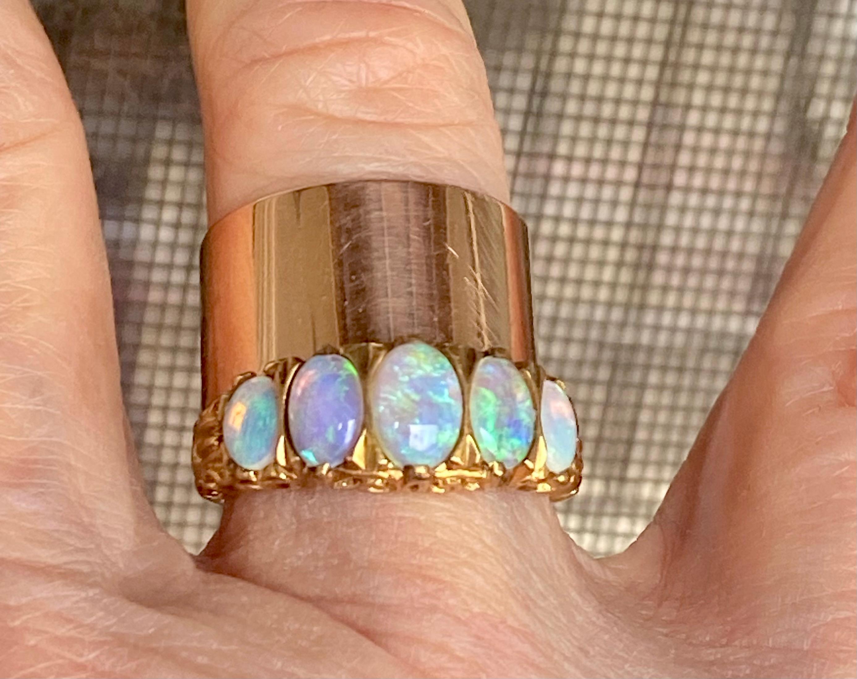 Favored as a wedding band choice in the last two years, this elegant, classic Victorian cigar band style ring comes to us from Australia c. 1895. The gold is 15 kt with a slight rose tint. The ring is silky and smooth.  It melts on the finger. This