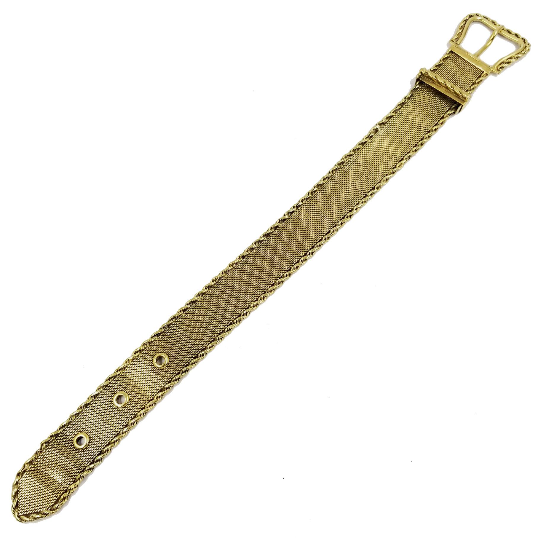 Flexible 18 Karat Yellow Gold Woven Mesh Antique Buckle Bracelet with Rope Accents. Belt Type Closure with Safety Catch. Adjustable Length Fits 7.25 inch to 8.5 inch wrist. Total length is 9.75 inches. Measures approximately 0.75 inches wide.