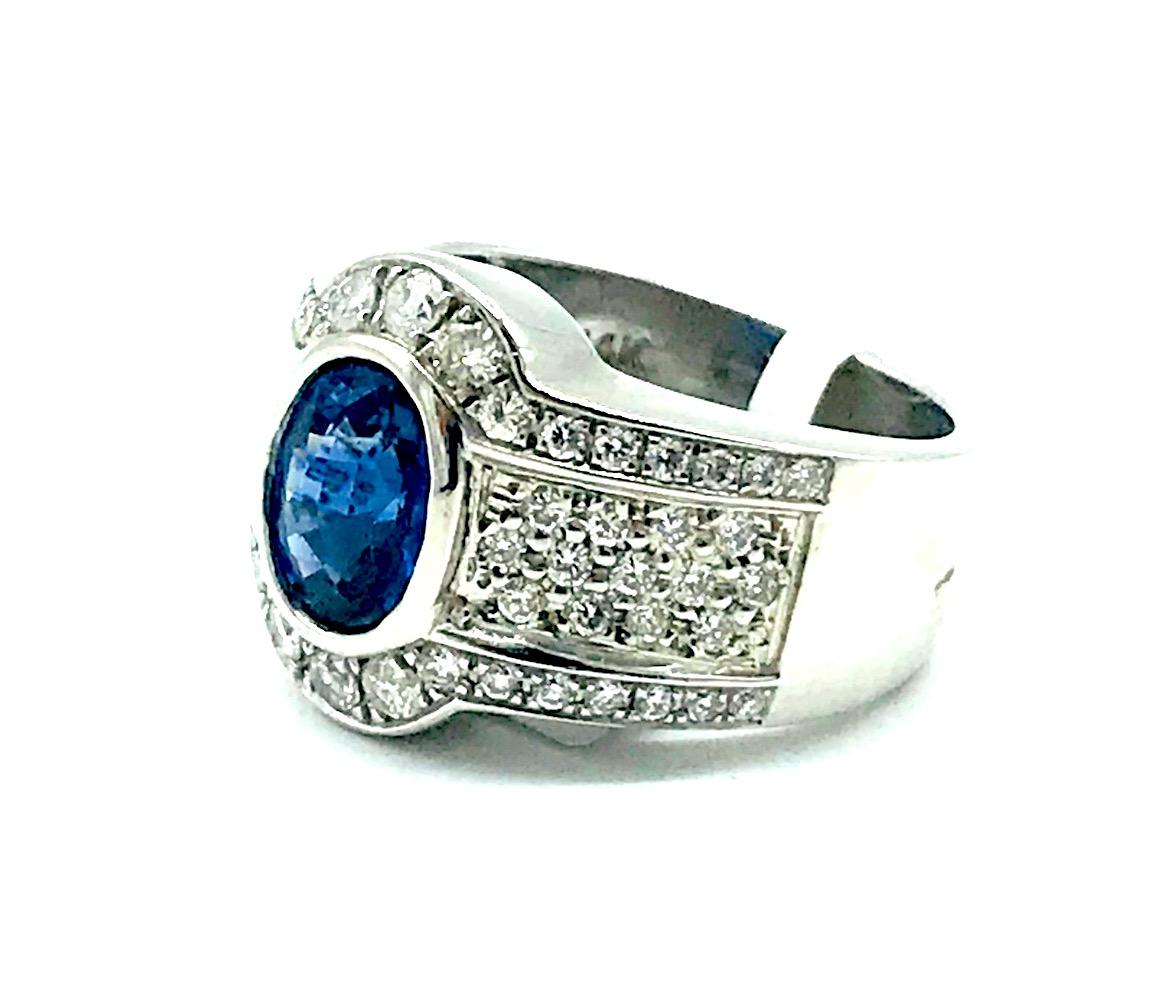Wide, Sapphire Halo 2.53 CT. and 1.50 CT Diamond Ring, 
 Bezel set, oval sapphire measures 8.75 x 6.77 x 4.97 mm has an estimated weight of 1.50 carat.  Quality is SI1-2 clarity and G-H color.
Weight of ring is 13.3 grams. Finger size is 7
GIA