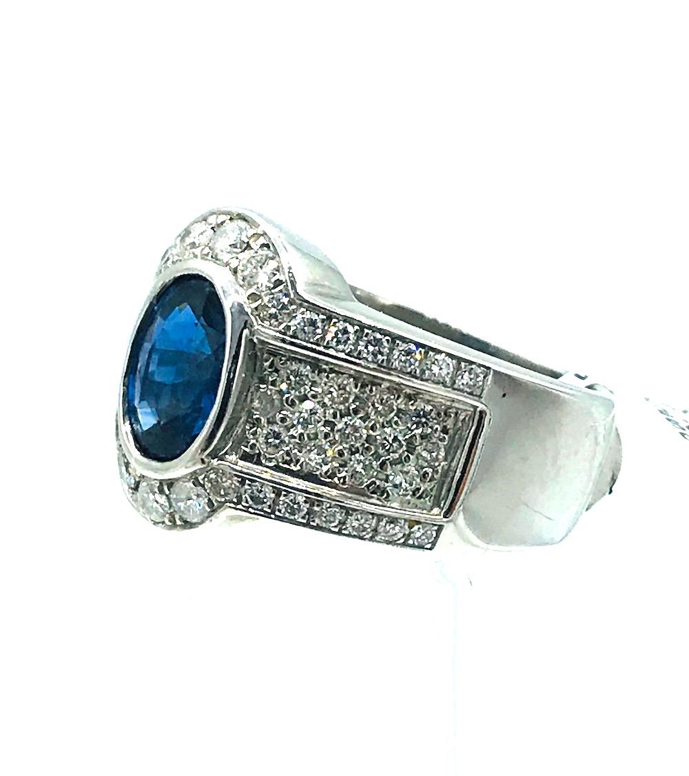 Contemporary 2.53 Sapphire Halo 1.50 Carat Diamond Ring For Sale