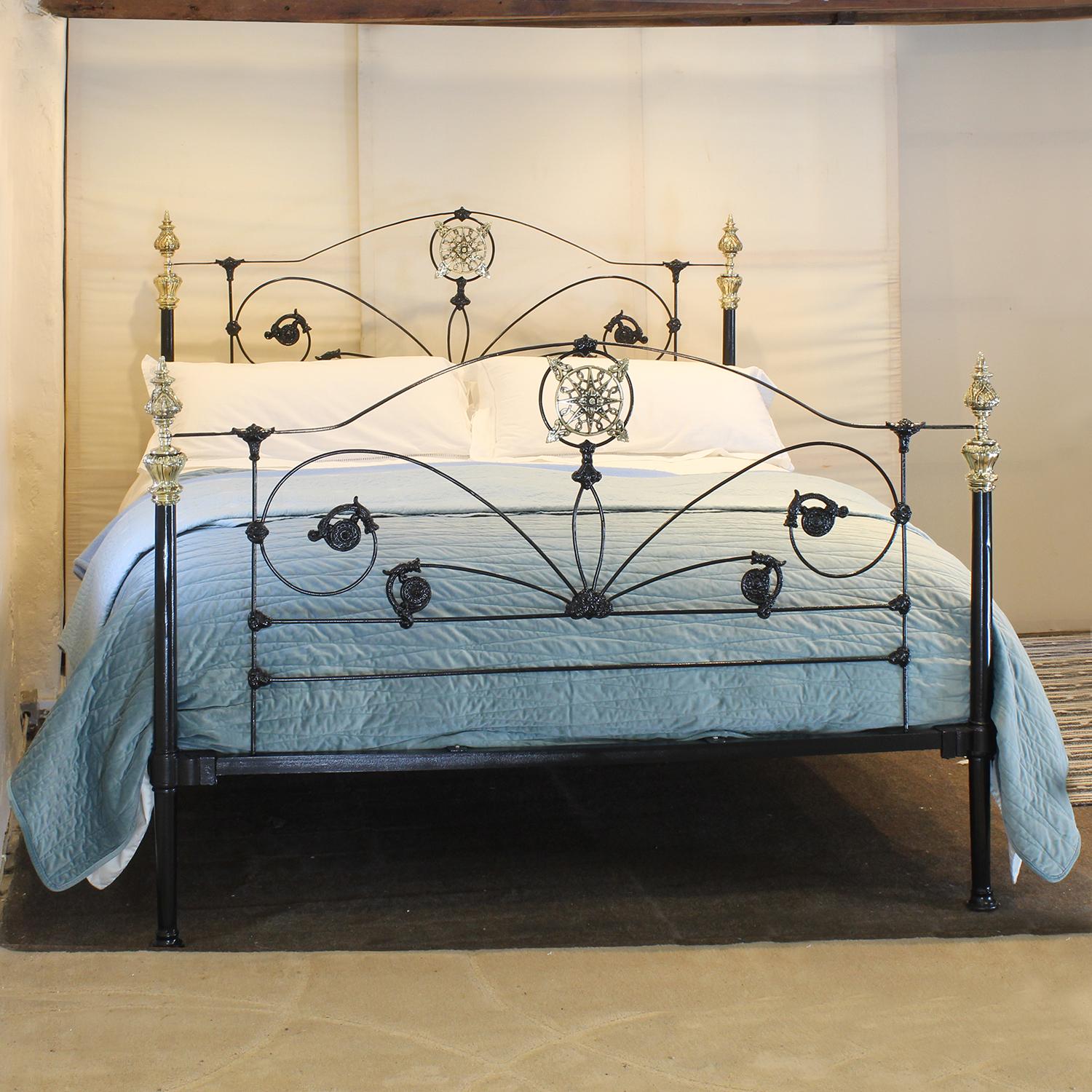 Ornate cast iron and brass bed finished in black with decorative panels and cast iron fittings.

This bed accepts a UK Super King or Californian King Size (6ft, 72 in. or 180cm wide) base and mattress set.

The price includes a standard firm bed