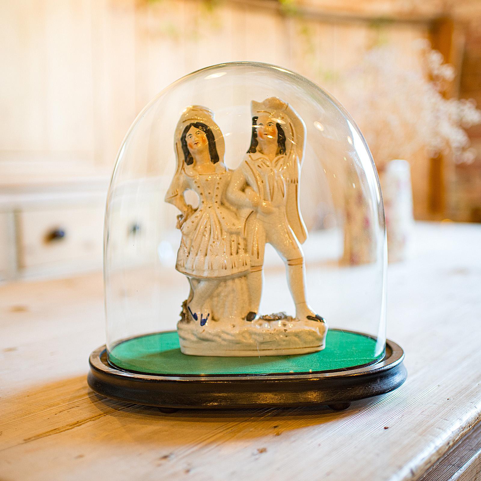 
This is a wide antique clock dome. An English, glass over ebonised pine display showcase, dating to the mid Victorian period, circa 1860.

Superb size, ideal for a larger mantel clock
Displaying a desirable aged patina and in good order
Bright dome