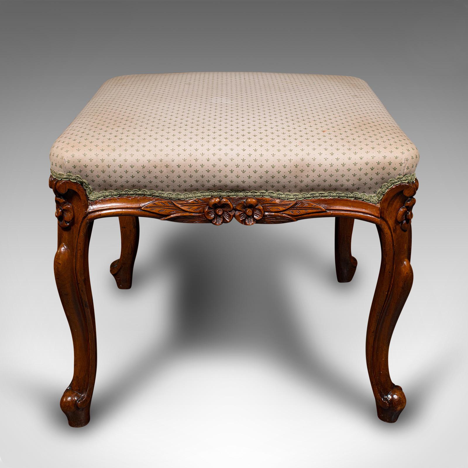 This is a wide antique dressing stool. An English, walnut bedroom seat, dating to the early Victorian period, circa 1840.

Comfortable and of a generously wide proportion
Displays a desirable aged patina throughout
Delightful walnut frame shows fine