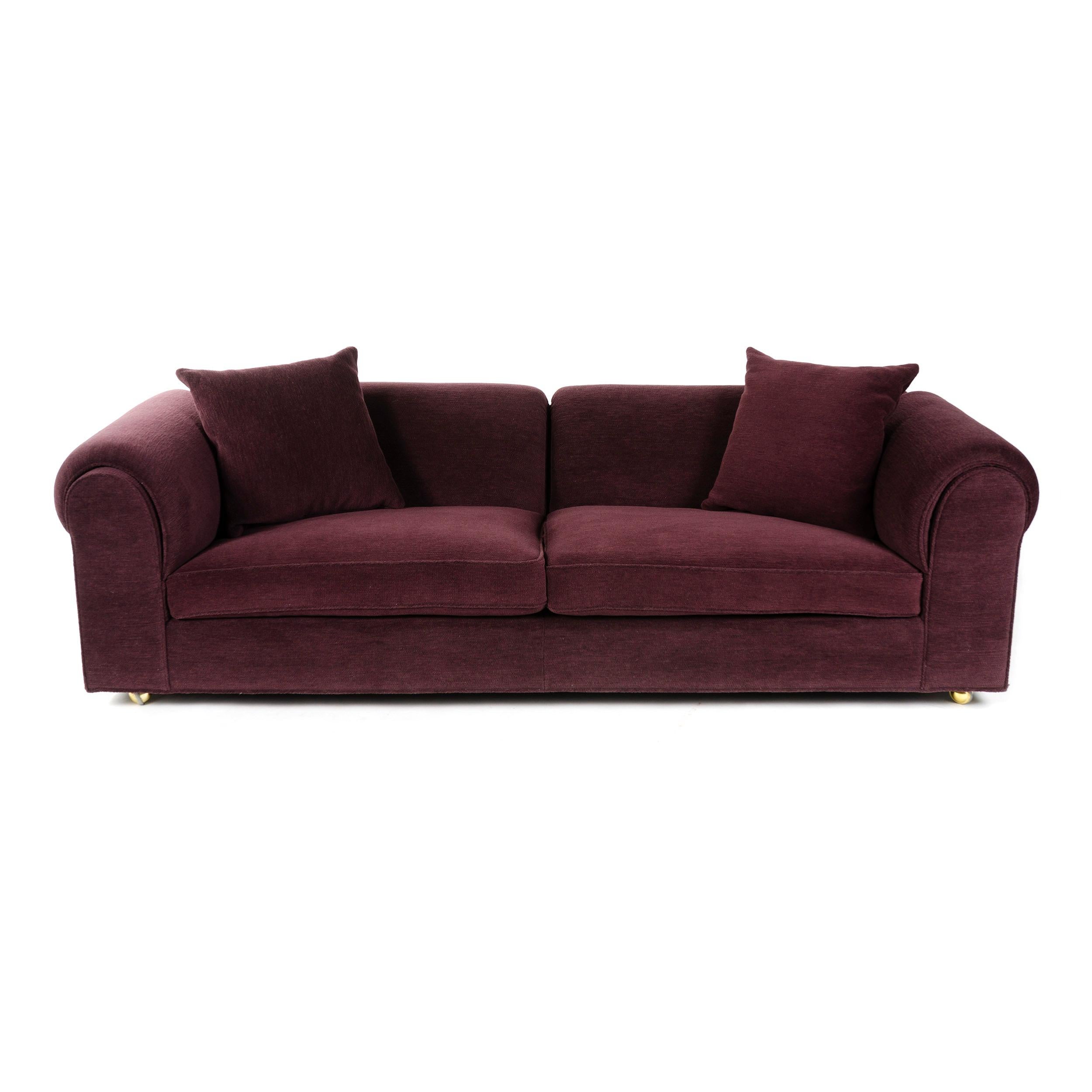 A well scaled sofa with a tight upholstered back and wide arms, newly upholstered in deep purple chenille.