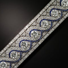 Wide Art Deco Platinum Diamond and Calibre Sapphire Bracelet