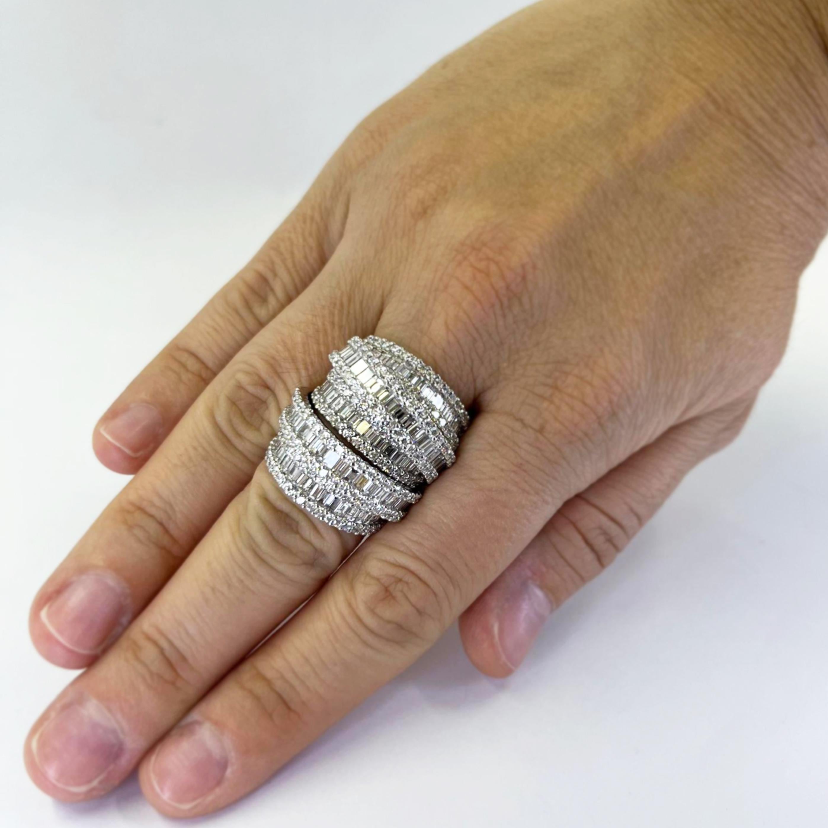 Enormous 18 karat white gold 3D stack ring featuring 300 round brilliant and baguette cut diamonds of VS clarity and G color totaling approximately 5.50 carats. Comfortable tapered design at back. Finger size 6.5. Finished weight is 24.5 grams.