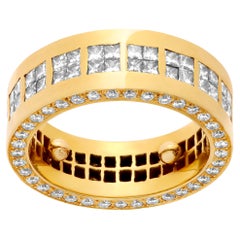 Wide band in 18k yellow gold with approximately 2.16 carats in diamonds
