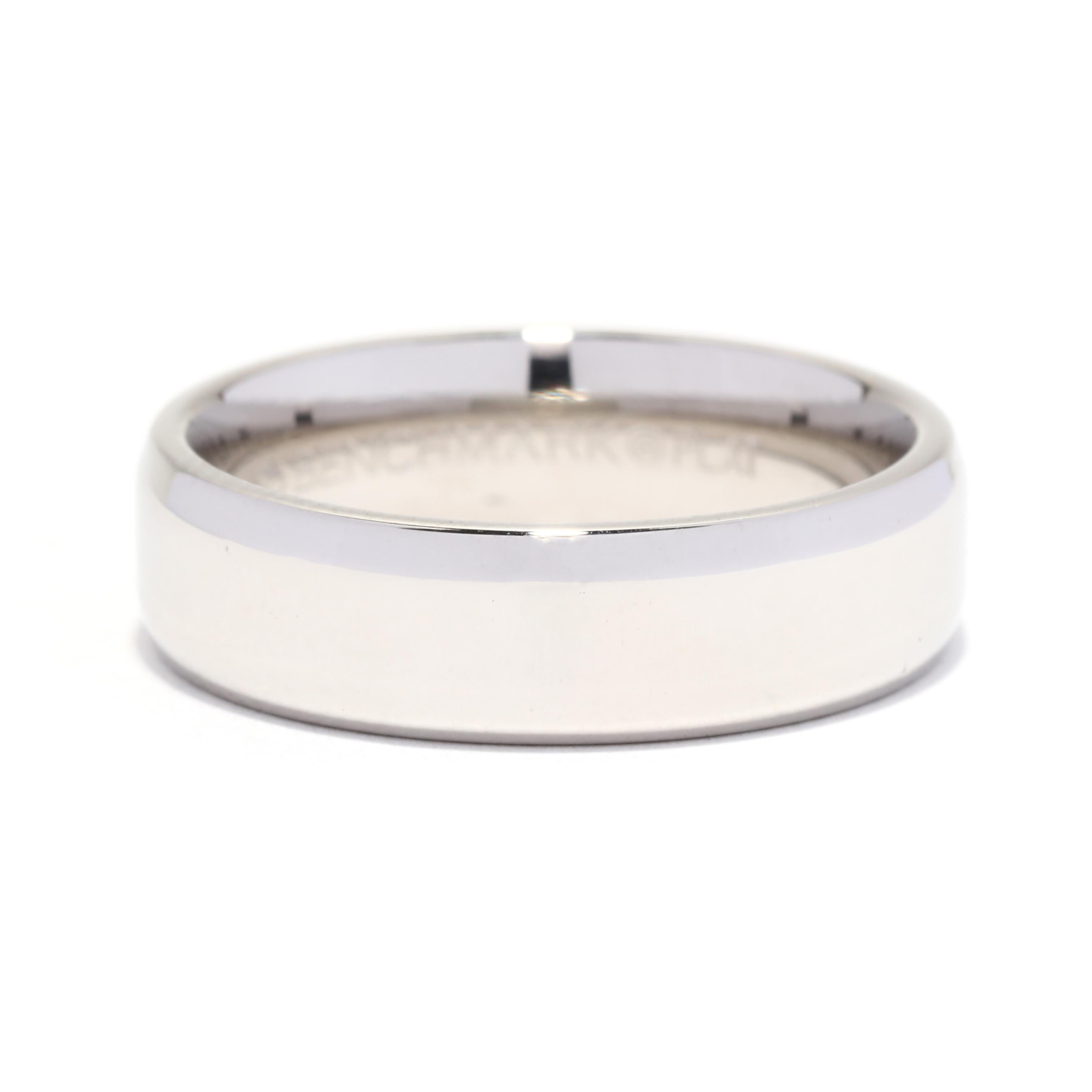 A vintage platinum wide beveled wedding band. This plain band features a polished plain band with bezel edging.

Ring Size: 8

Rise Off Of Finger: 2 mm

Width: 5.9 mm

Weight: 7.7 dwts. / 12 grams

Stamps: BENCHMARK PLAT

Ring Sizings &