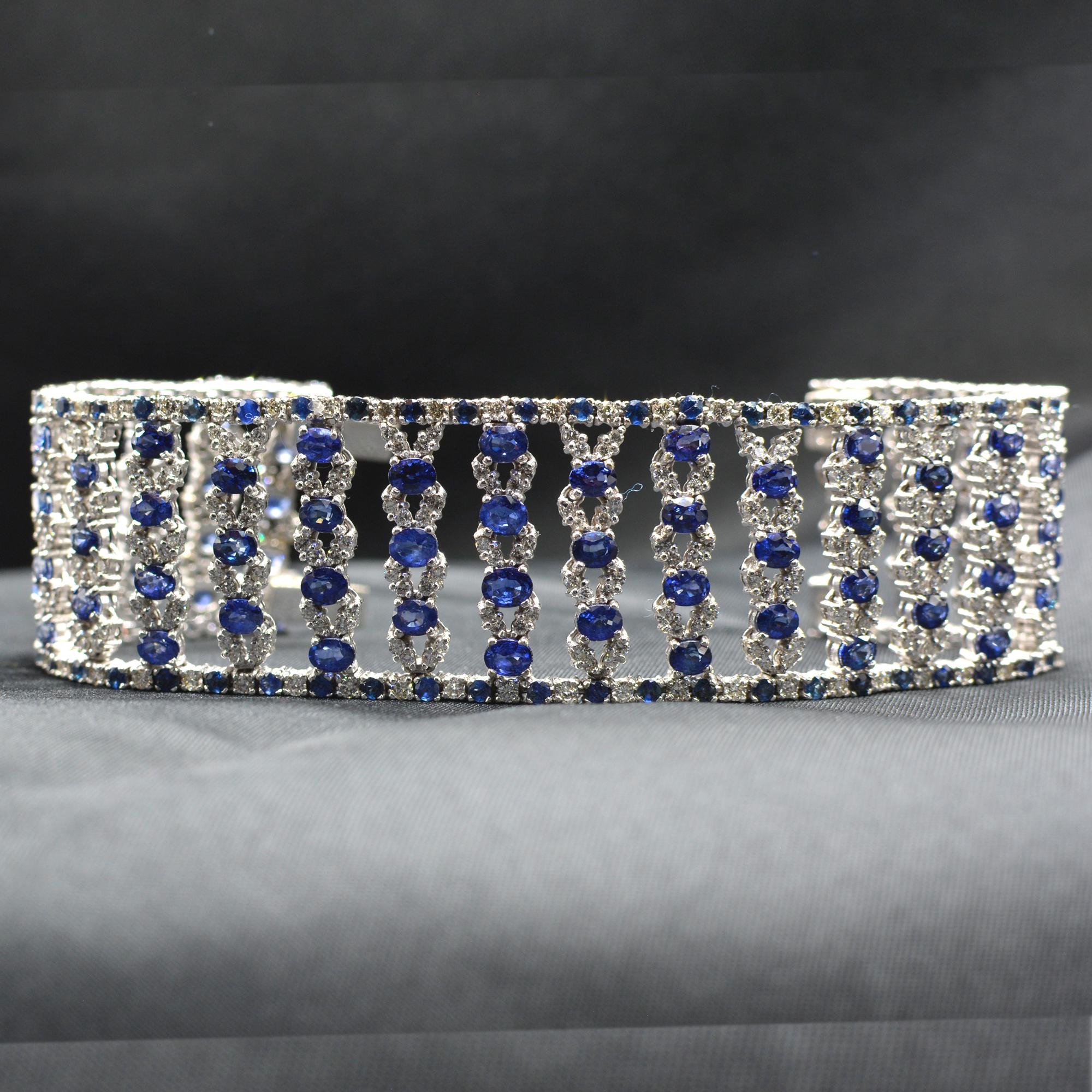 Very wide Blue sapphire and Diamonds Bracelet
oval shape AAA Quality Sapphires Total of 27.50 carat.
(each sapphire is approx. 3 x 4 mm)
Diamonds total of 4.0 carat  GH-VS.
14K White Gold 55.0 Grams.
Length 7' Inch.
Bracelet width is approx. 27 mm

